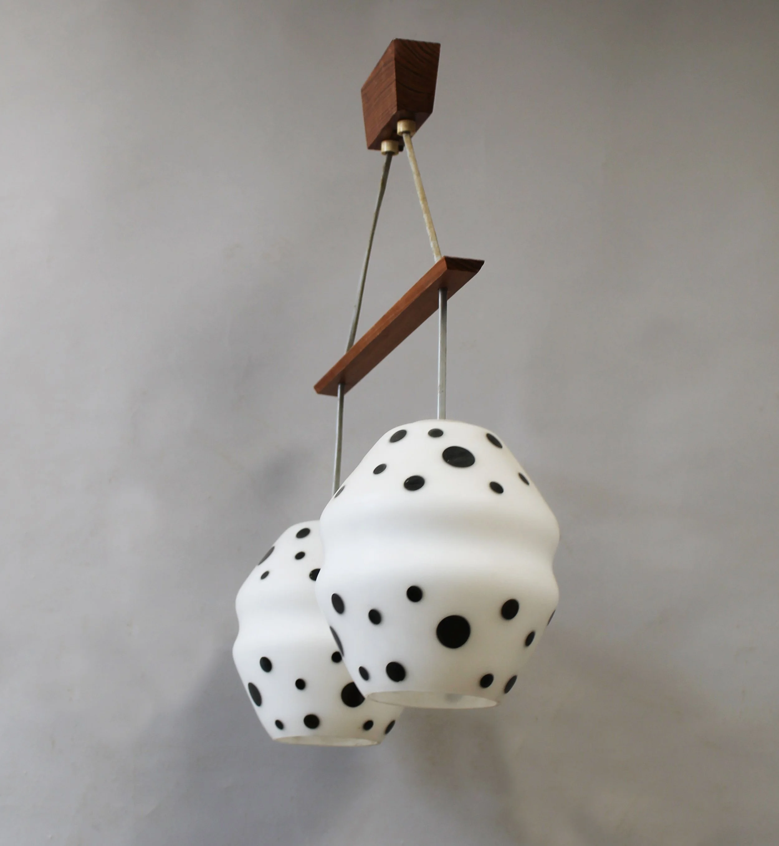 Vintage Czech pendant light showing organic opaline glass shade and wooden suspension detail
