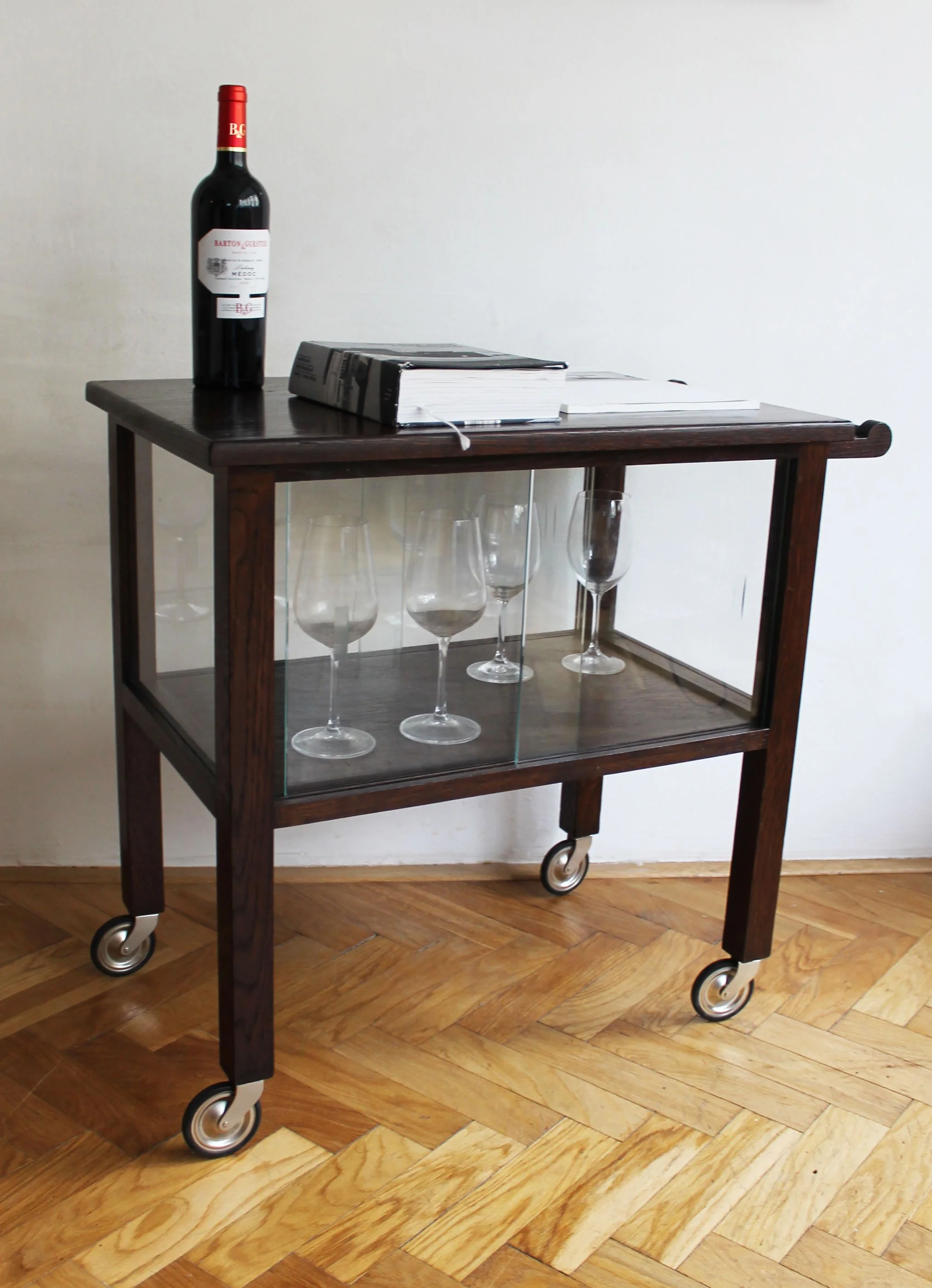 Glass-paneled lower compartment designed for bottles and glassware.jpg