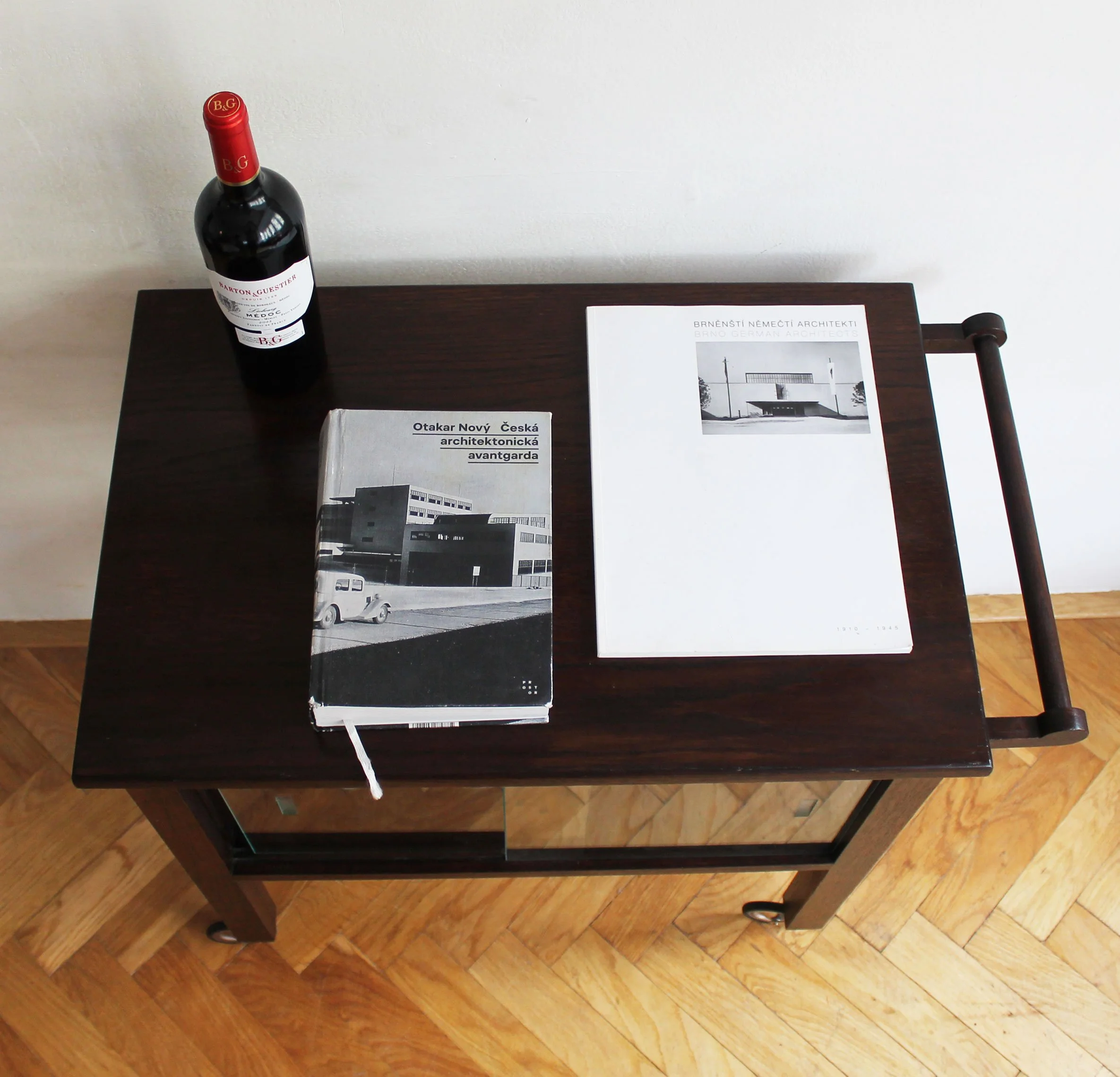 Detail of handle and wooden frame craftsmanship on vintage bar cart.jpg