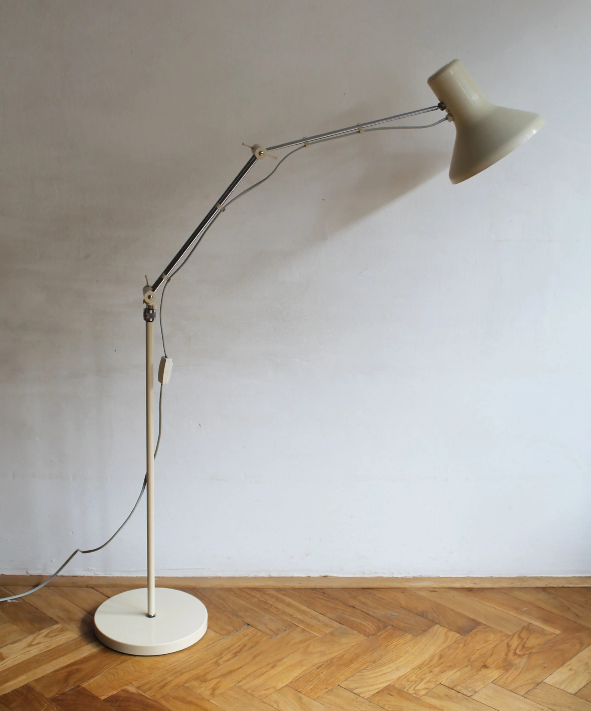 Perspective shot highlighting contrast between beige shade and chrome supports