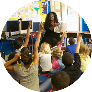 Teacher with children in classroom, by US Dept of Education, cc..png