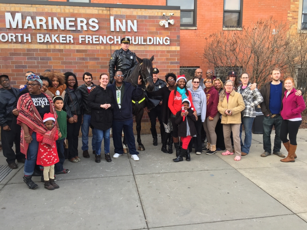  The staff of Mariners Inn, some of the volunteers, and two of Detroit's finest - Christmas Day, 2015