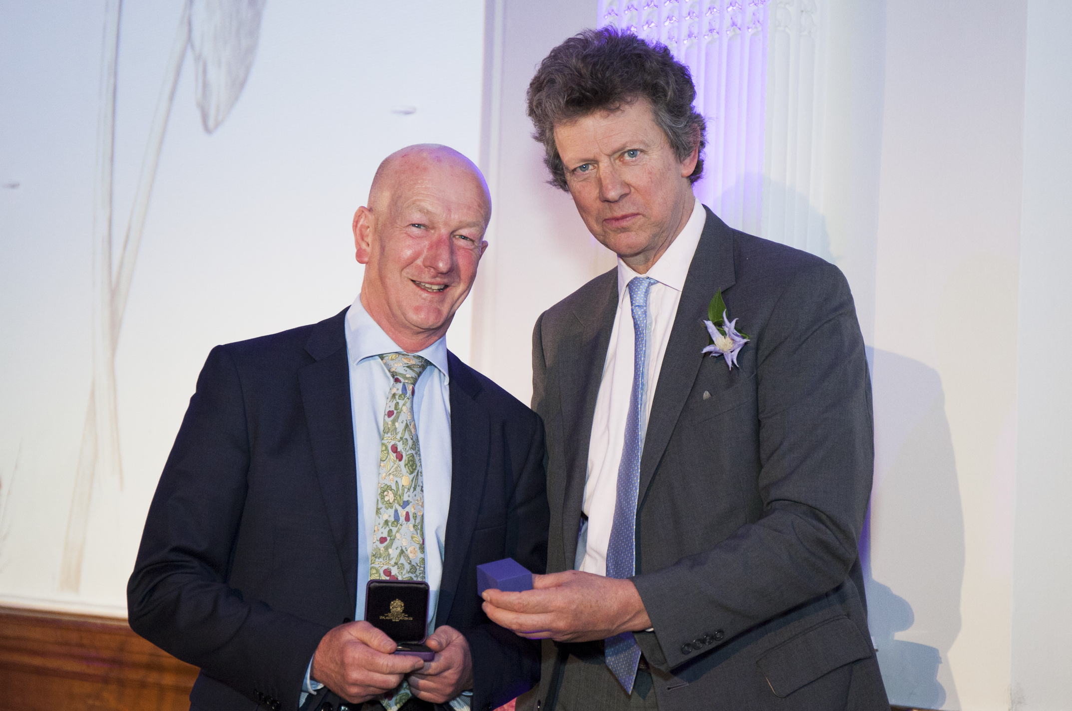 Andy McIndoe is presented with the Veitch Memorial Medal by Sir Nicholas Bacon. President of the RHS at the awards ceremony in the RHS Linley Hall on 22nd February 2017