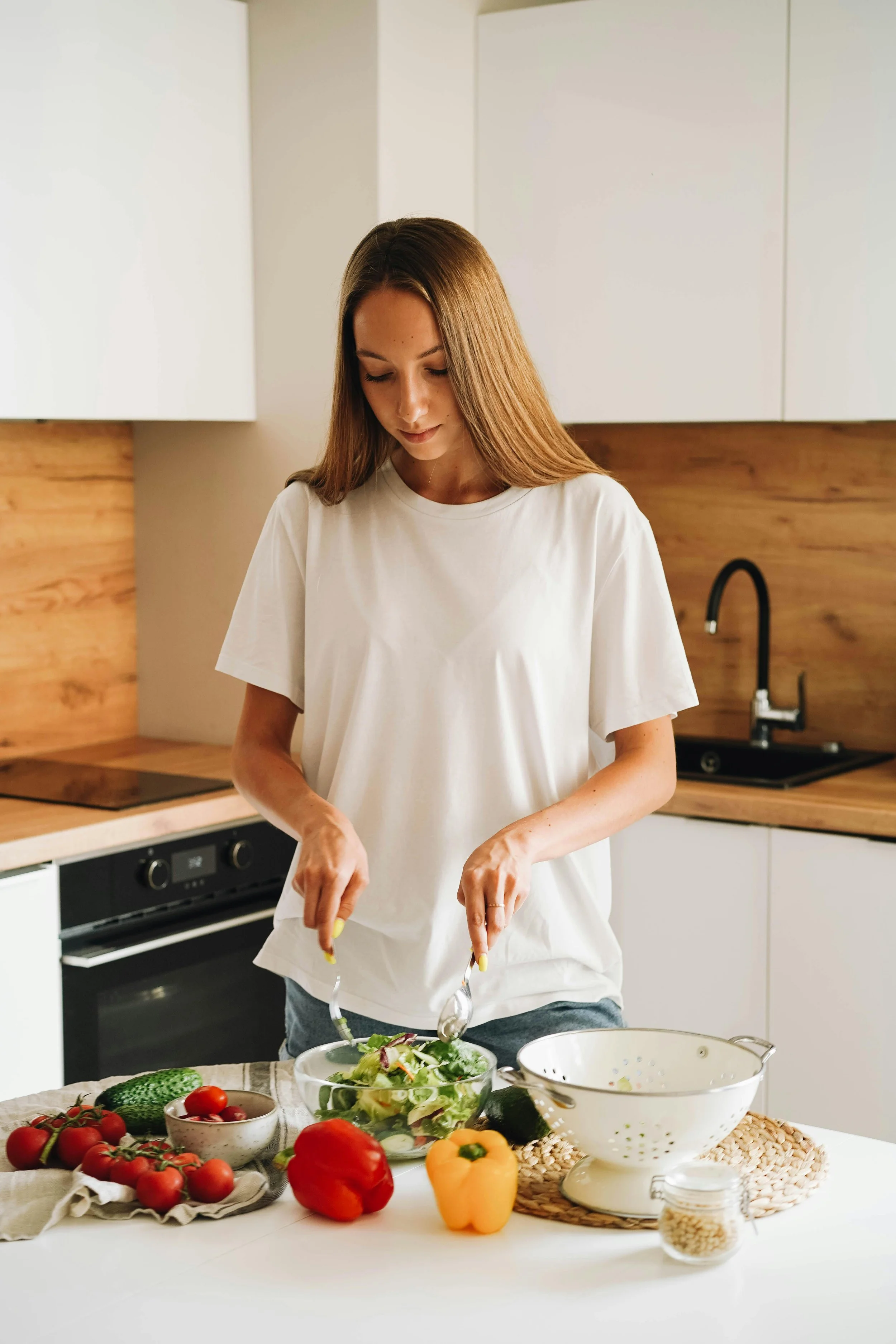 a woman preparing a salad