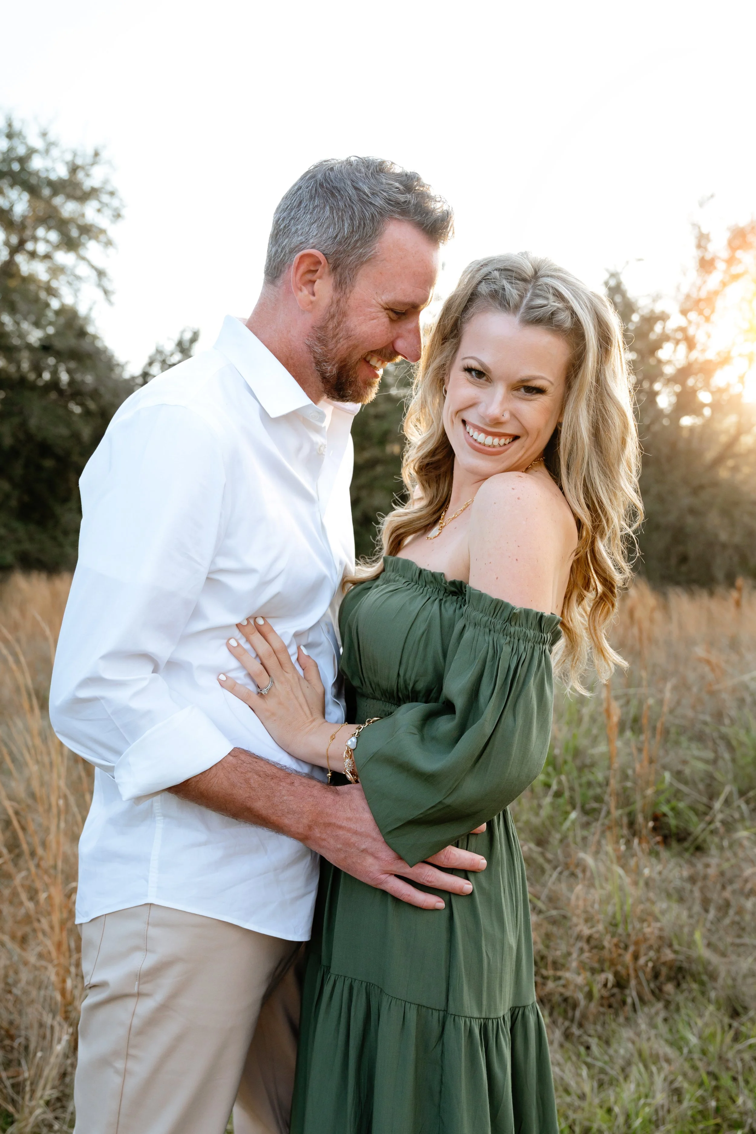 mom and dad pose for photo during professional family photography session in wesley chapel florida