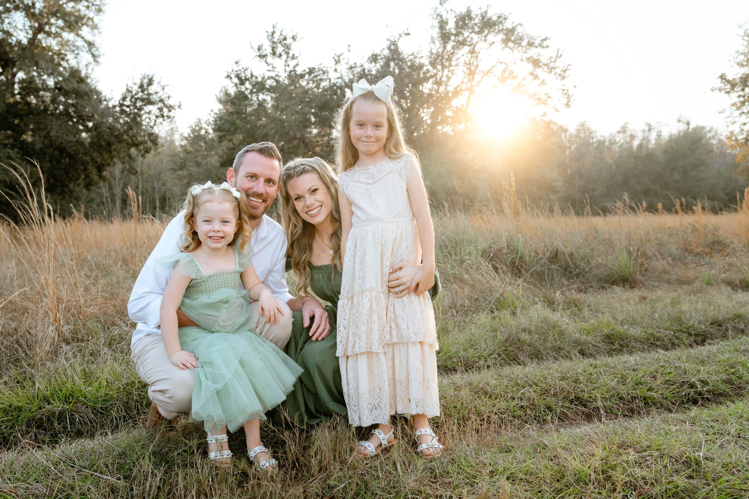 family poses for professional photos in Wesley Chapel Florida