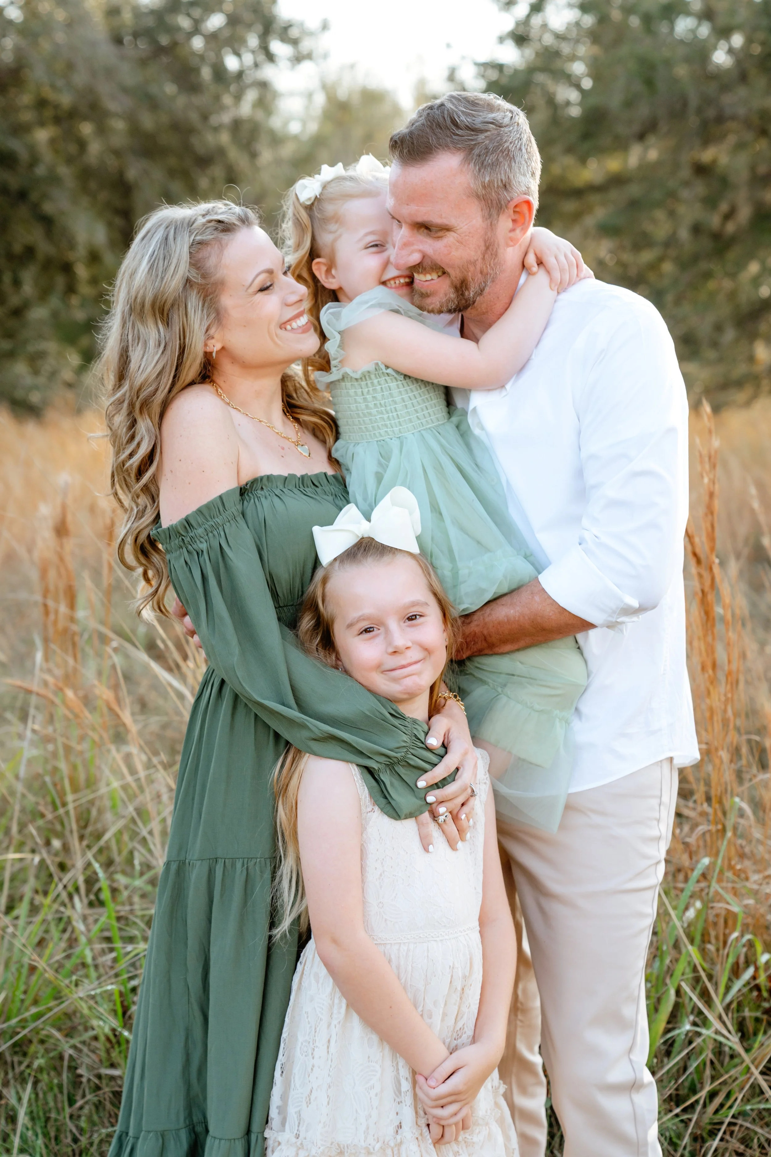 family poses for professional photos in Wesley Chapel Florida