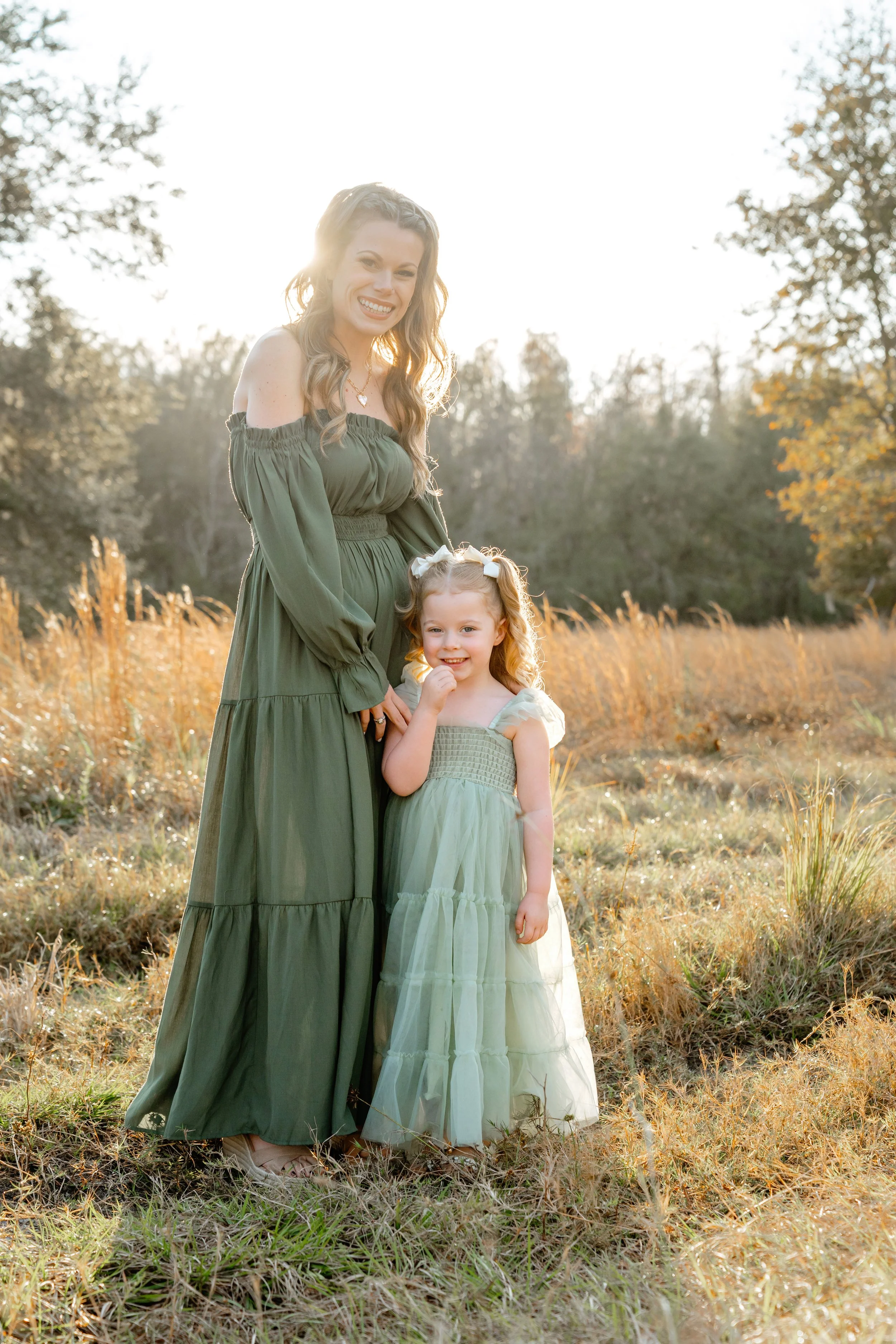 mom and daughter pose for professional family photos