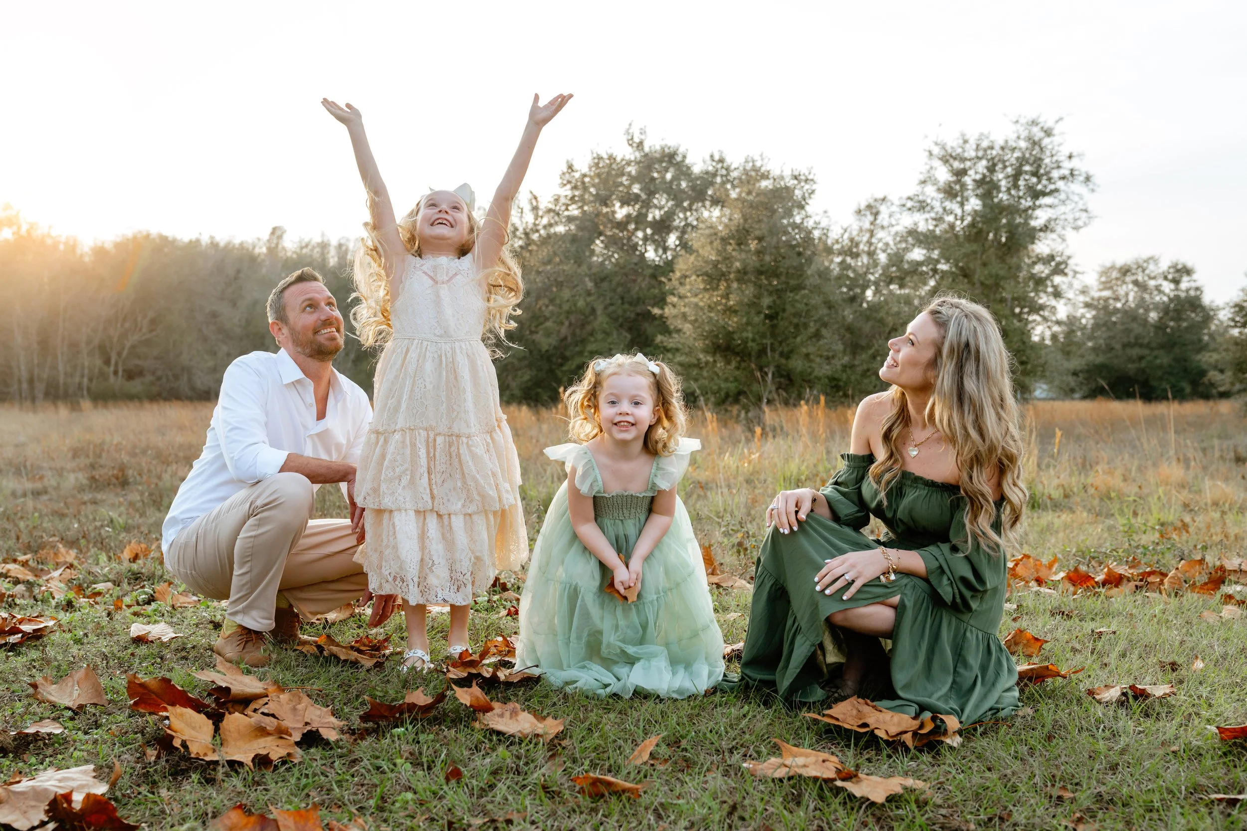 family poses for professional photos in Wesley Chapel Florida
