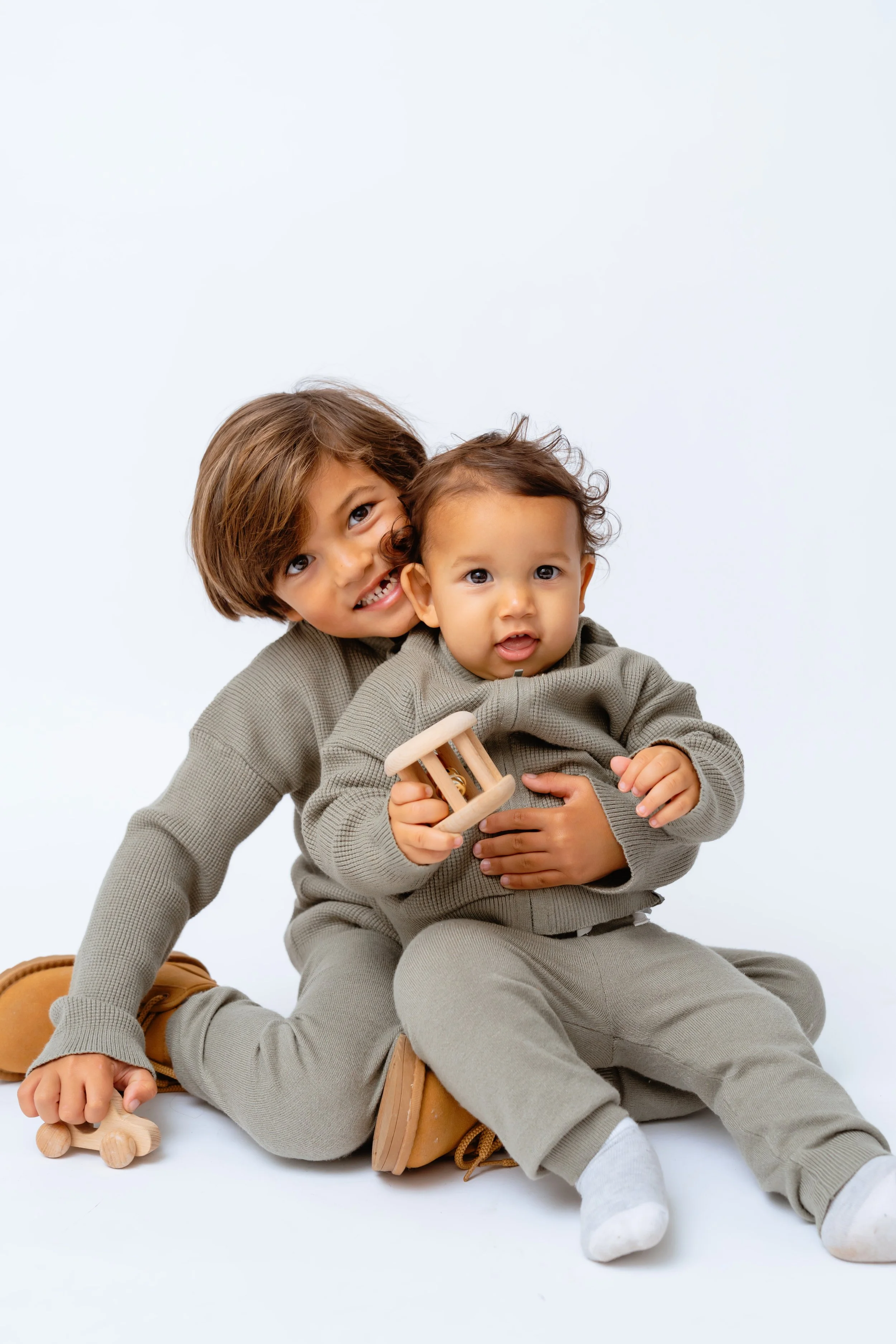 two young brother pose for a professional portrait at tampa photography studio