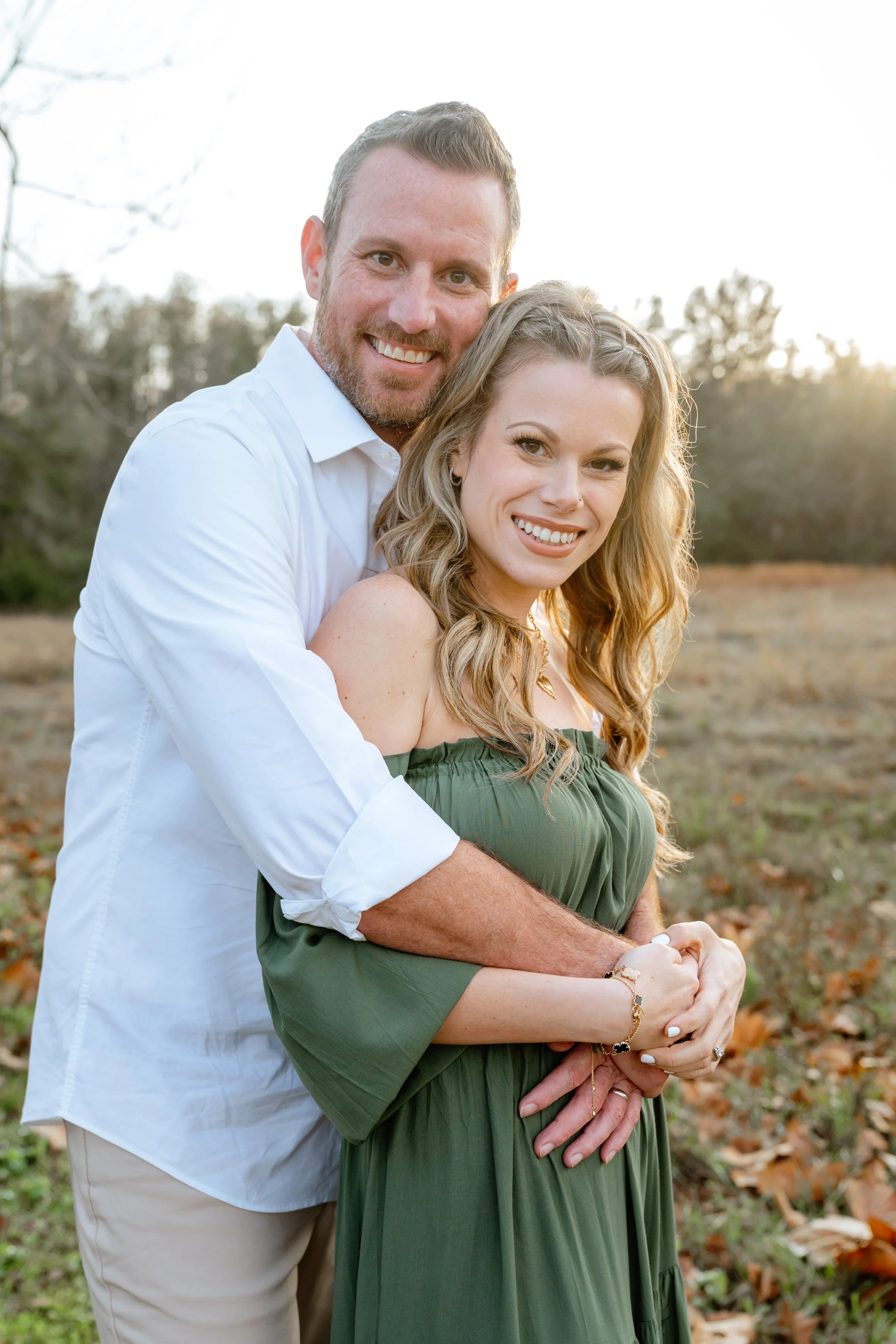 mom and dad pose for professional family photos near tampa florida