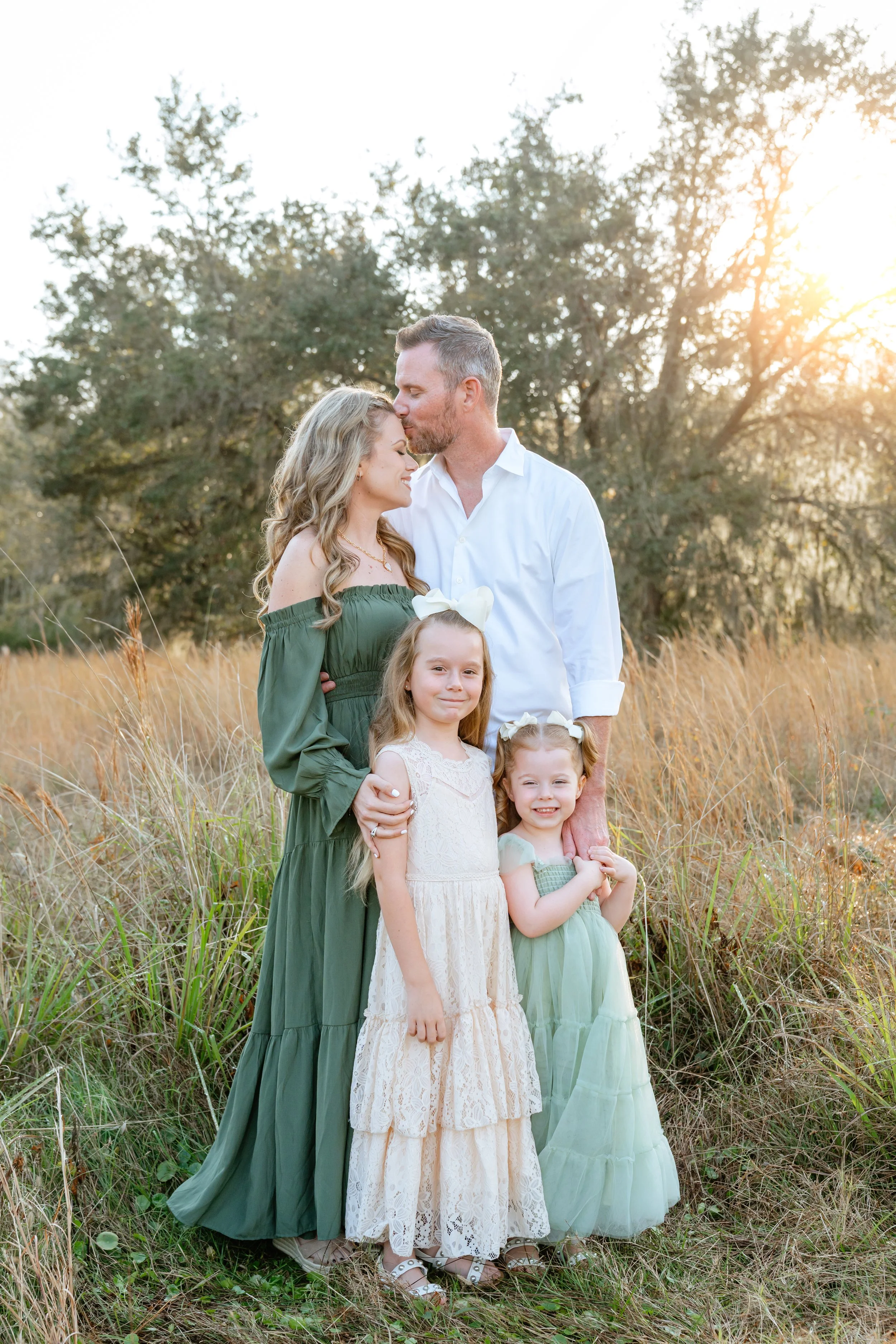 family poses for professional photos in Wesley Chapel Florida