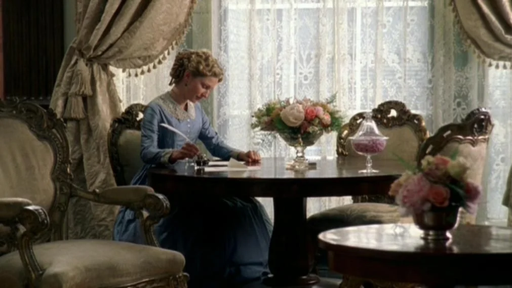 Edith enjoys the comforts of England’s wealth and power.