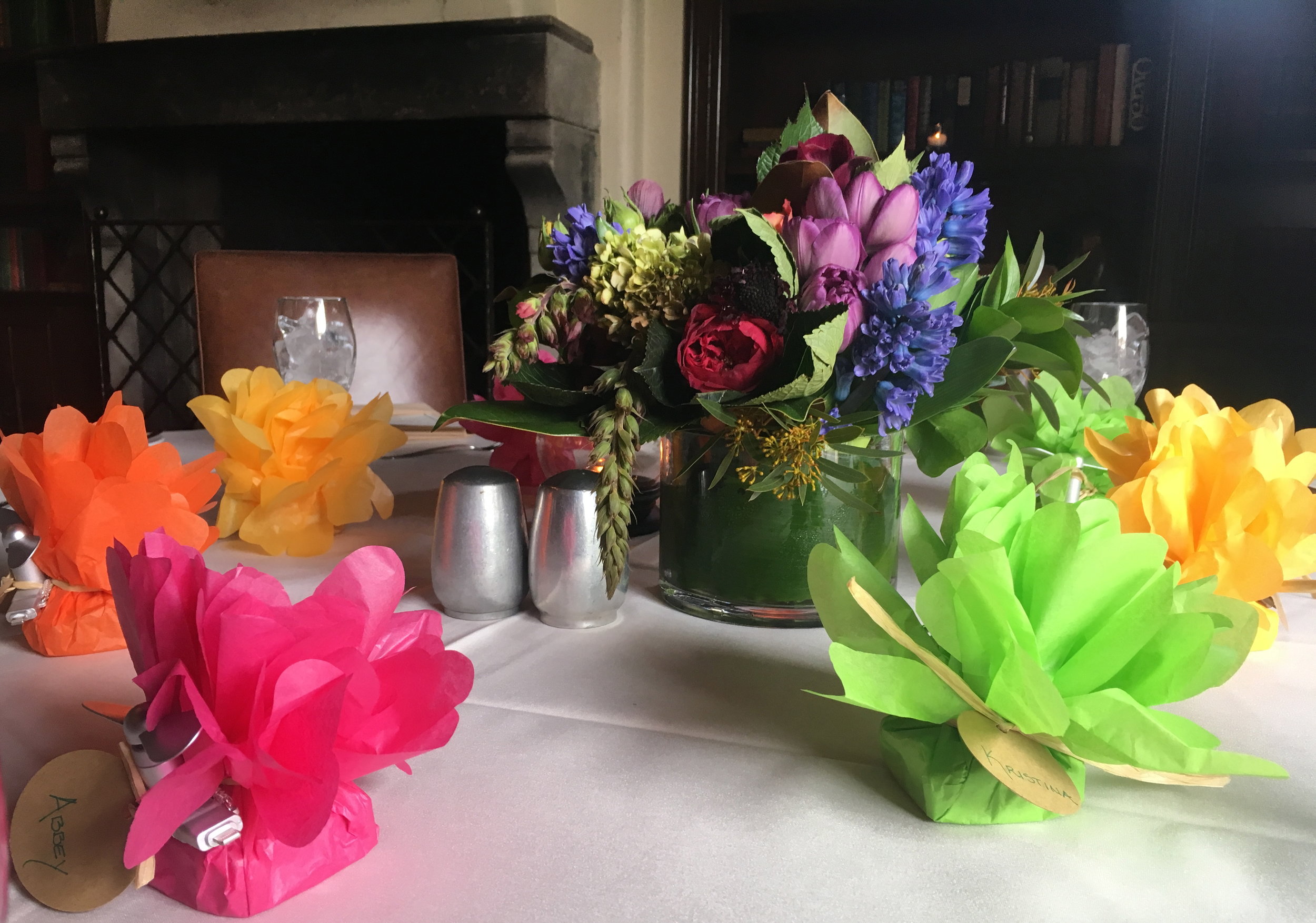 Favors and flowers adorn the library tables, ready for our guests.
