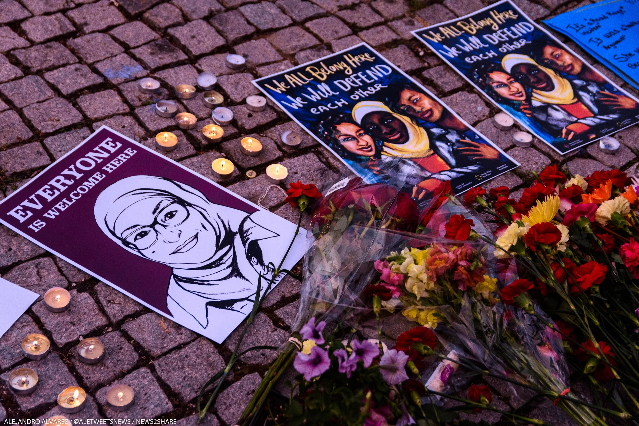 Flowers and candles are laid down next to the Dupont Circle fountain, a frequent site for vigils and community prayer after tragedies.