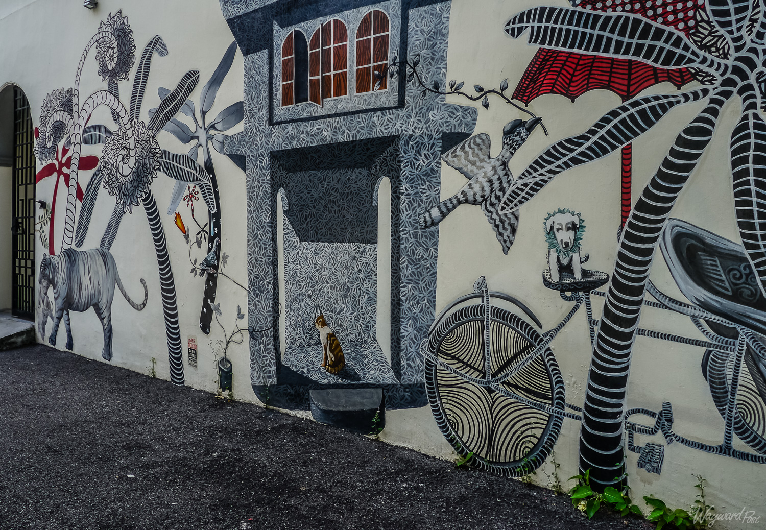 On the side of Hotel Penaga's Clarke building is this mural by artist-in-residence Oceu Apristawijaya. Photo by Johanna Read TravelEater.net 
