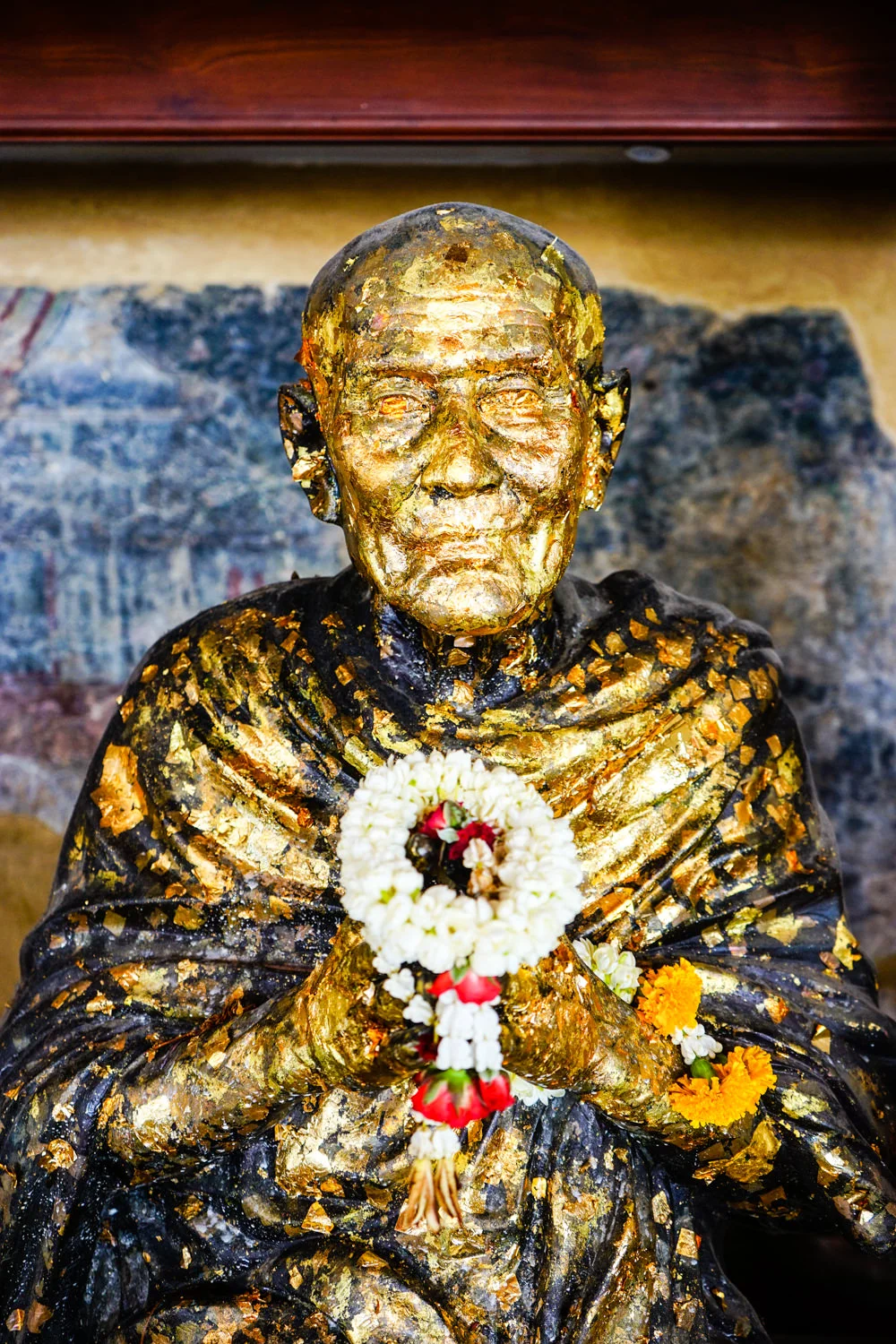 Old golden monk. I wonder how much money he is wearing right now. Sony A7 FE28-70mm @ 35 1/60 sec ISO 320