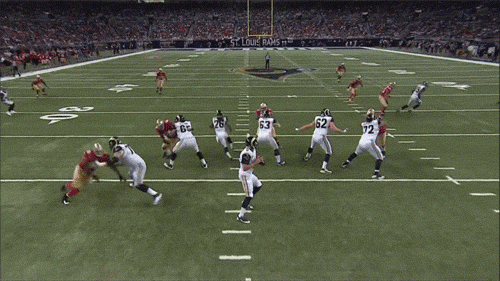 This is a fumble, because the ball got knocked out of the QB's hands while his arm was still moving backwards. Afterwards, everyone on both teams dive to try and get control of the ball.