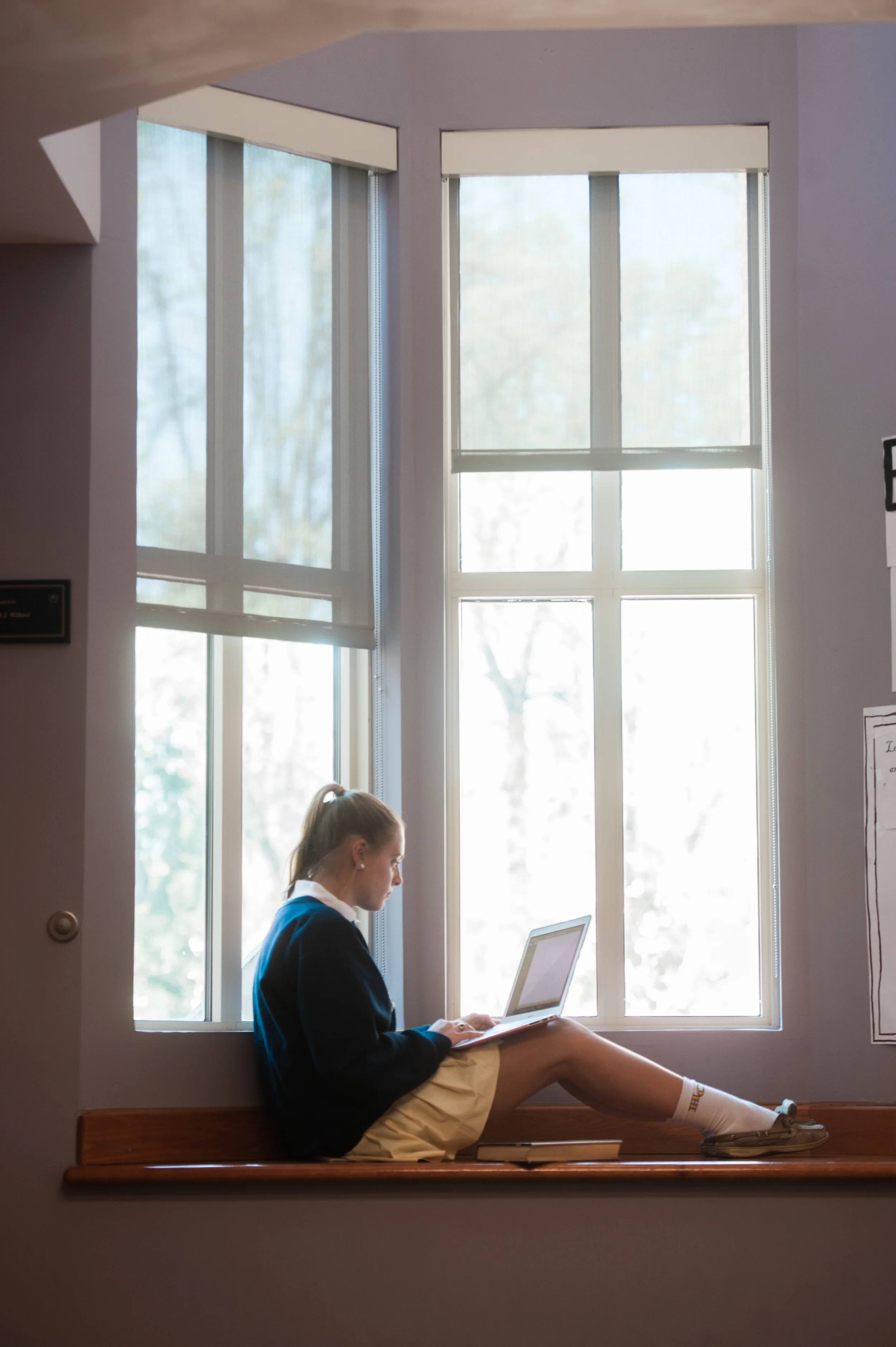 Girl studies in the window during a break at private school, education, Washington DC, Virginia