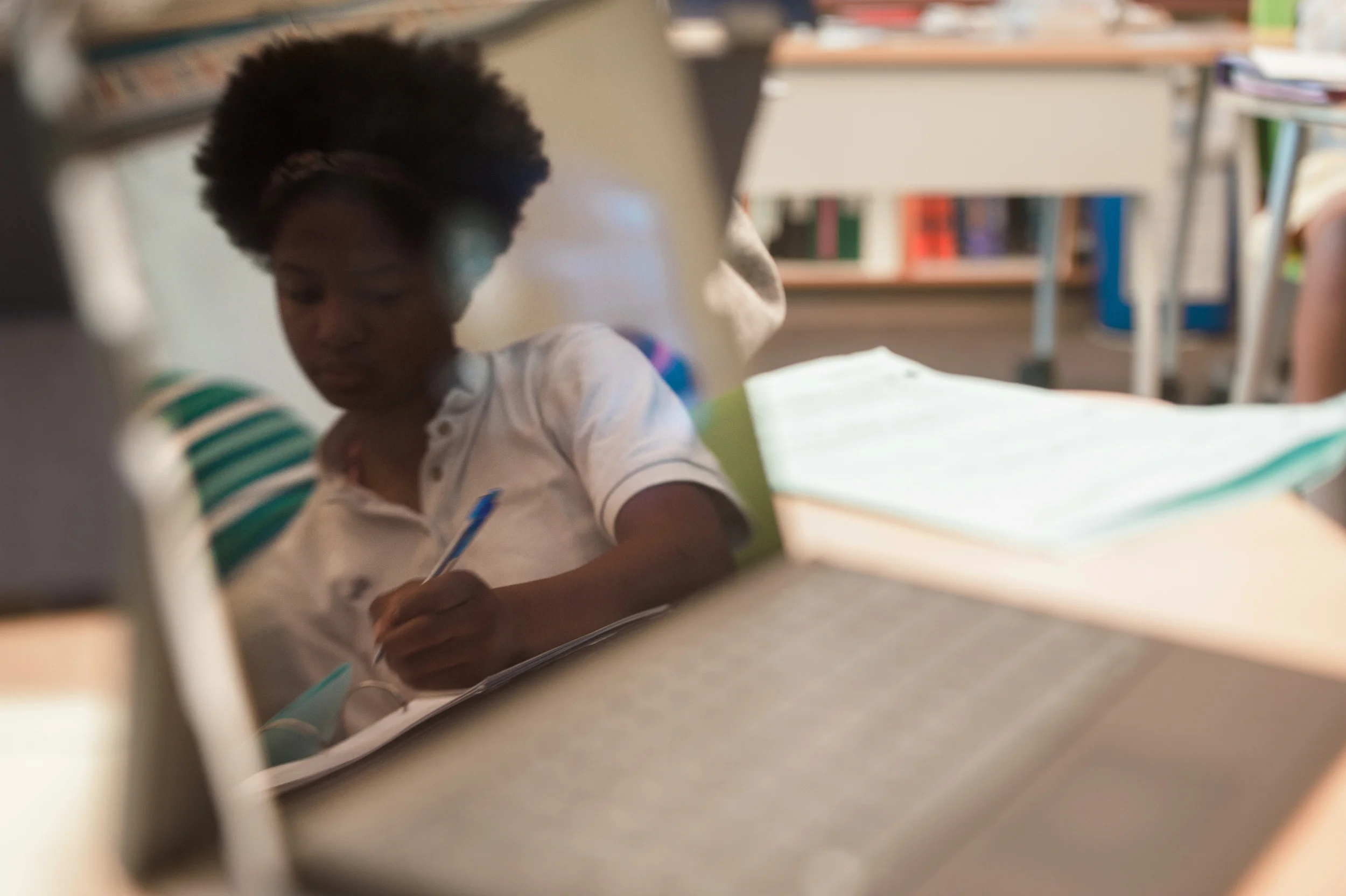 Education, Student reflected working in laptop screen, Private School, Washington DC, Virginia