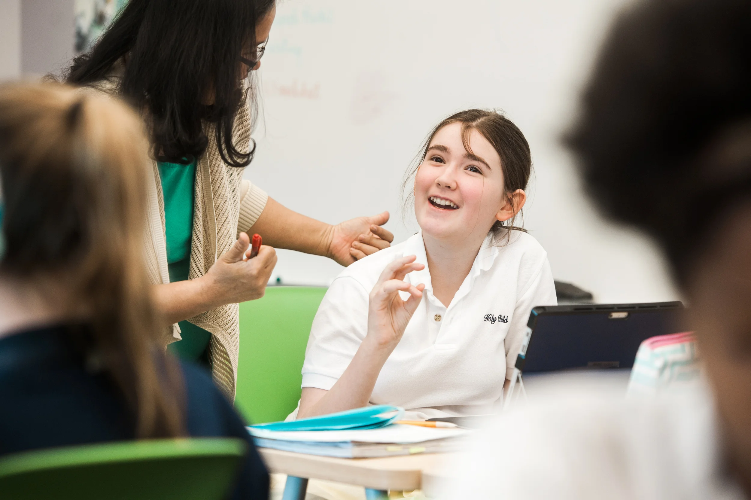 Education - Private school student discussing assignment with a teacher. Washington DC, Virginia.