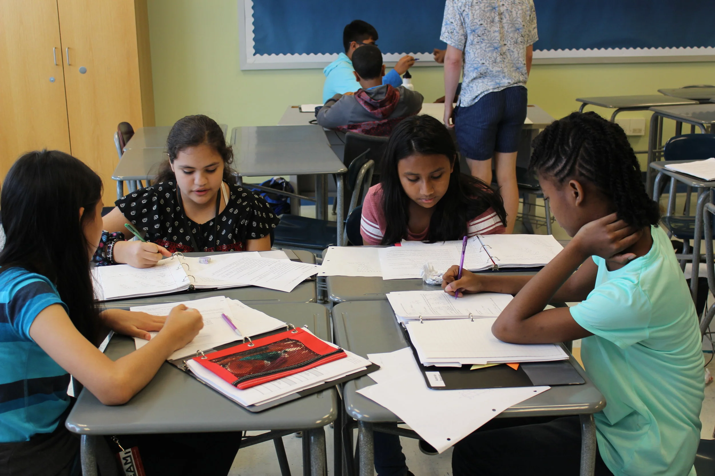 Nicole, Maryam, and Aamirah working during OMT