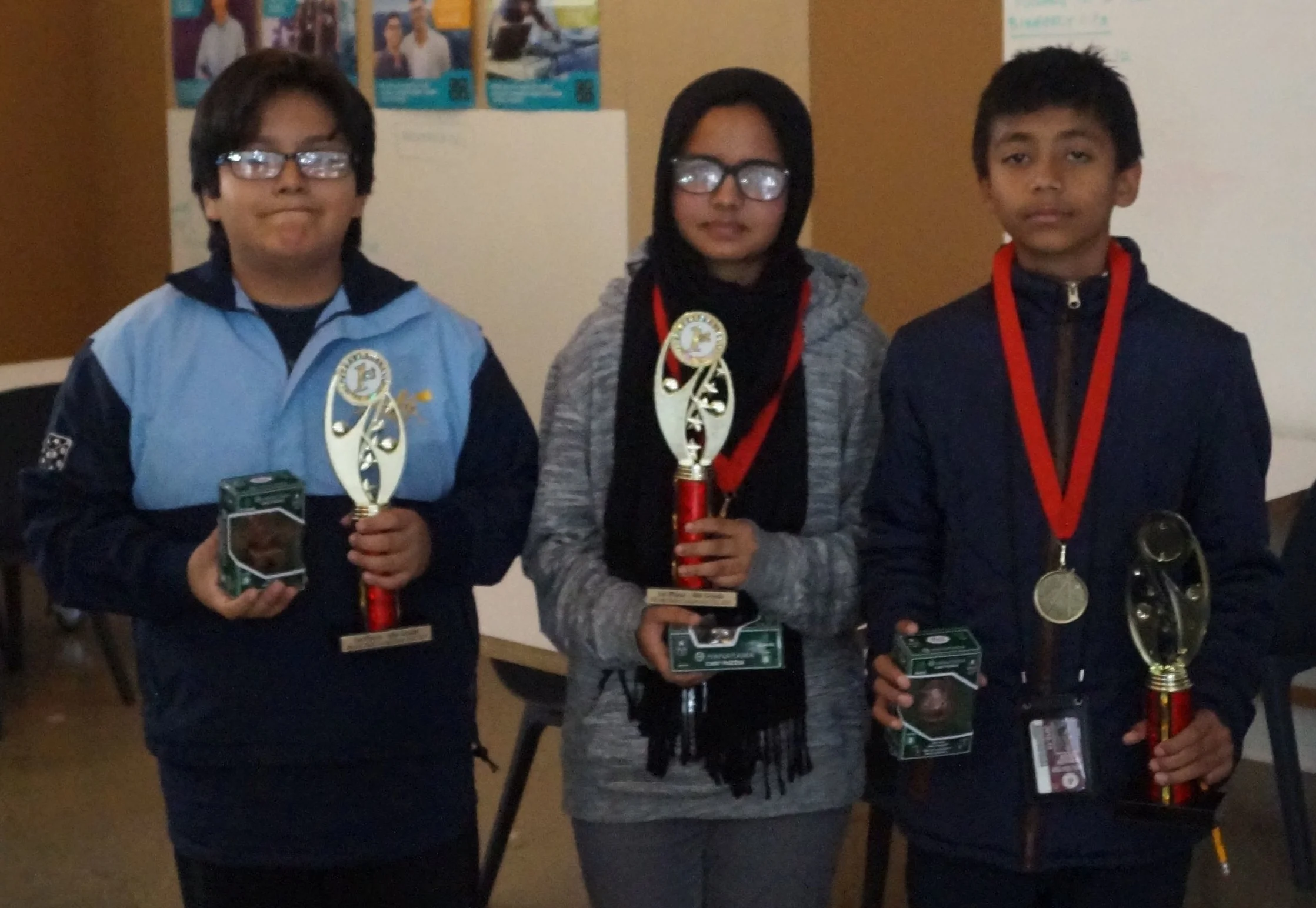 Kenny, Mayisa, and Adib were the top three individual competitors. Adib answered 17 of 18 questions correctly in the individual round!