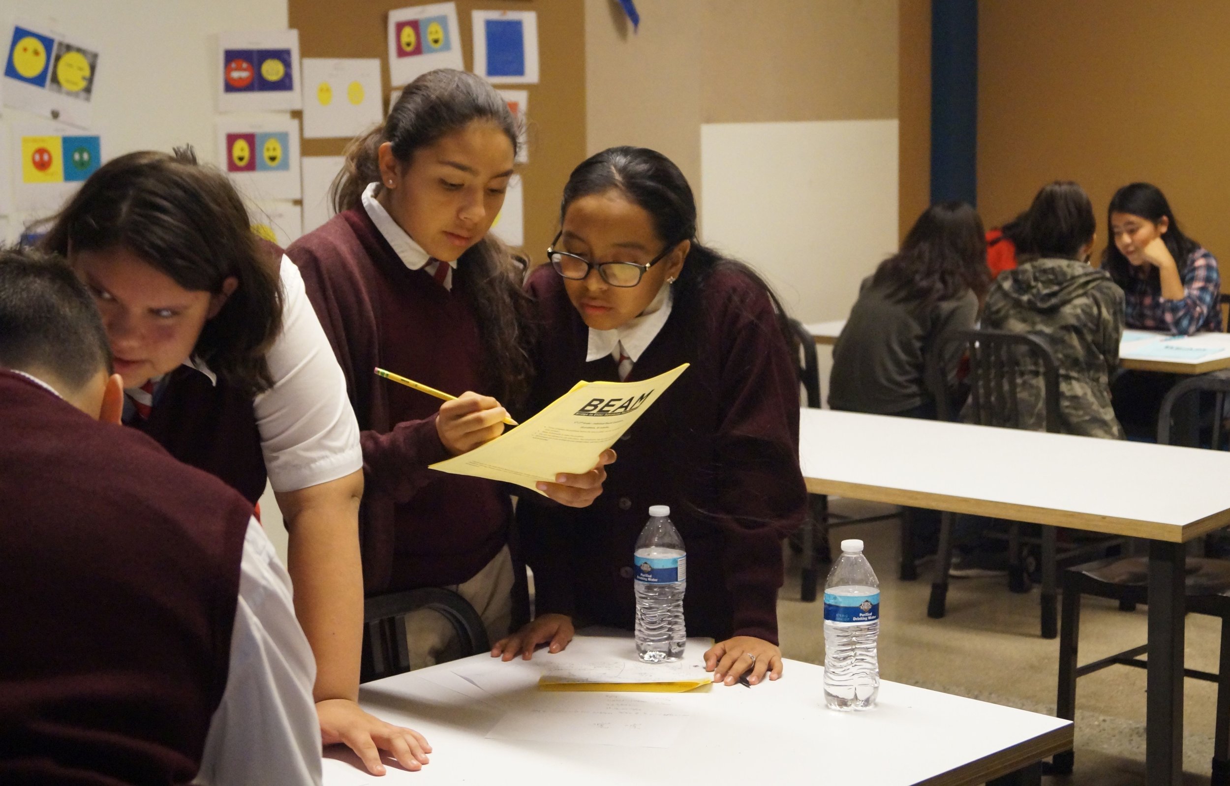  A group of students from Synergy Kinetic Academy discusses individual round problems. 