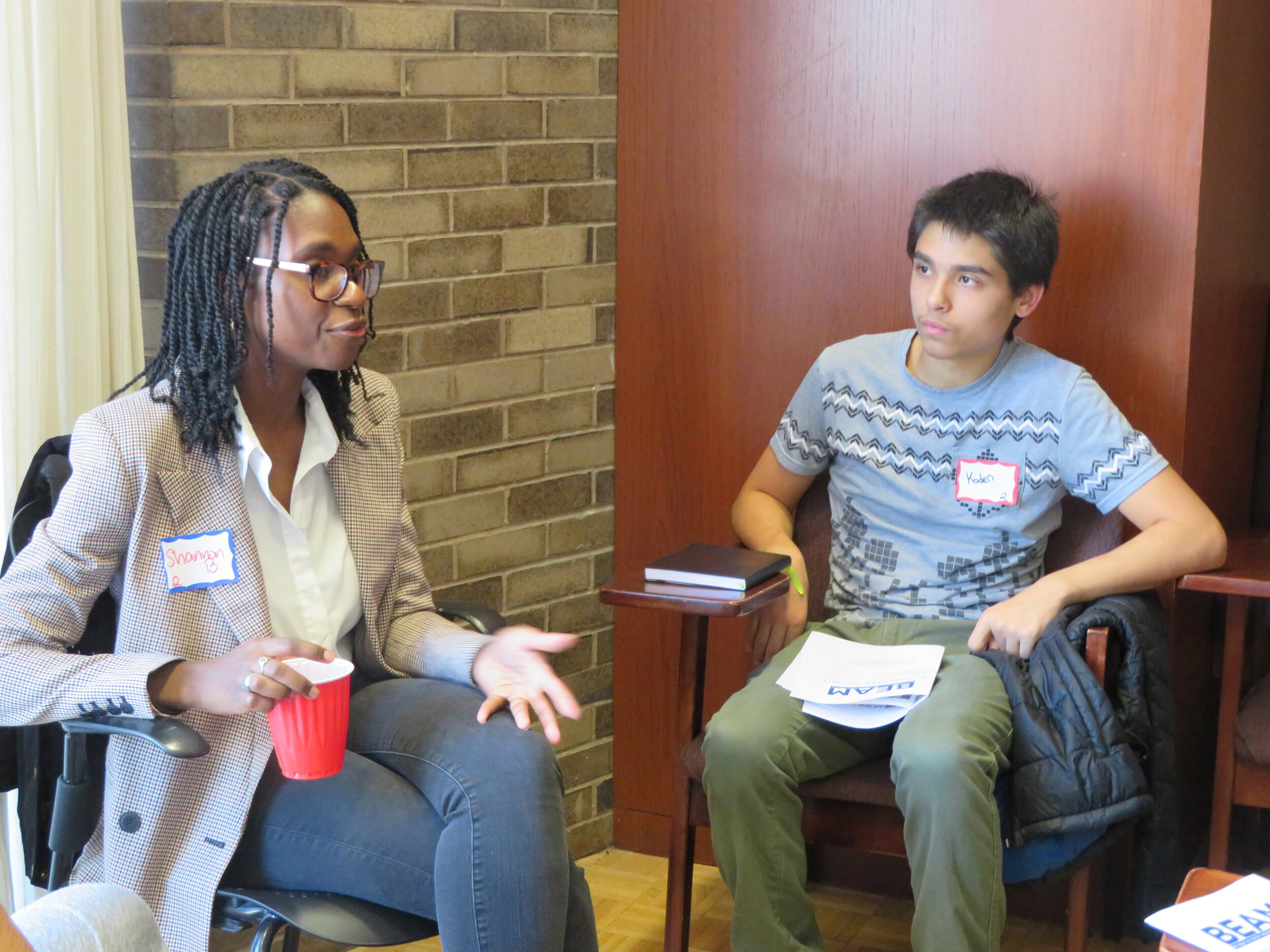  Shannon B. conversing with Kaden and other students 