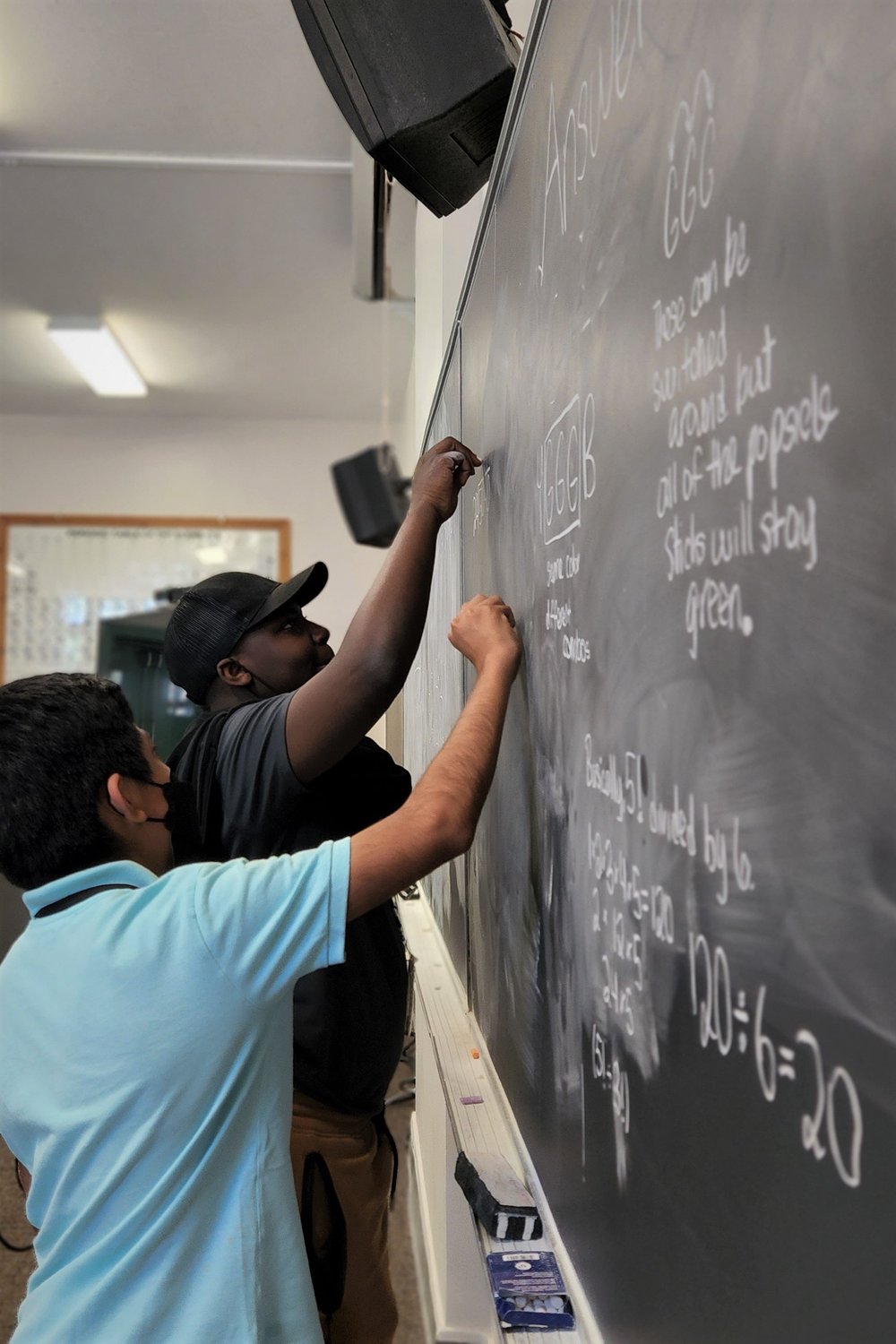 2 students working at board.jpg