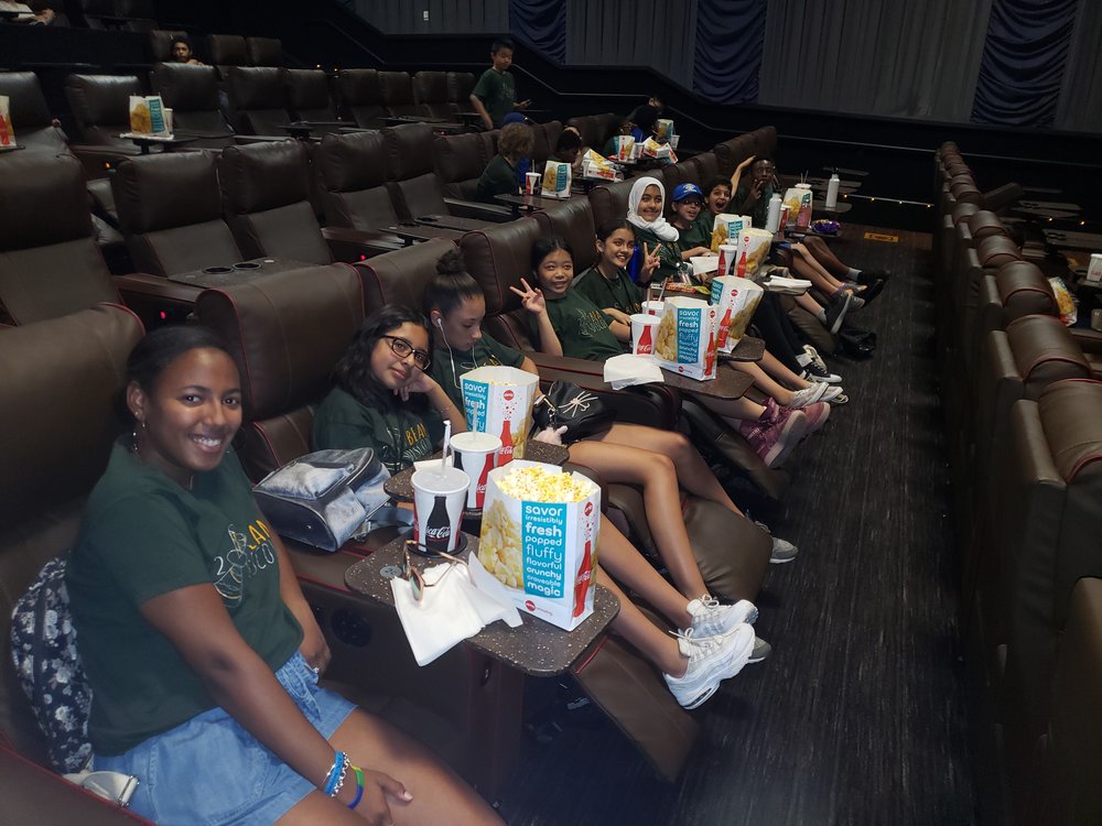  BEAM Discovery students took a field trip to the movie theatre! Zeñia sits on the far left. 