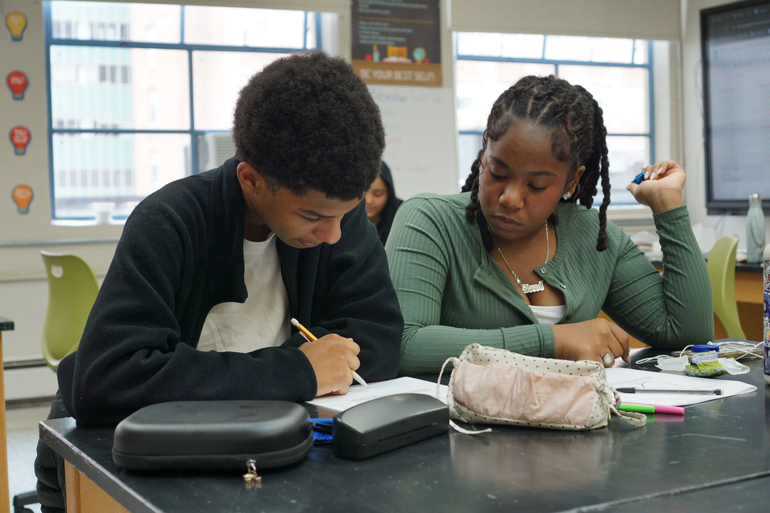  Two students work together during the Gnarly Geometry class in NYC. 