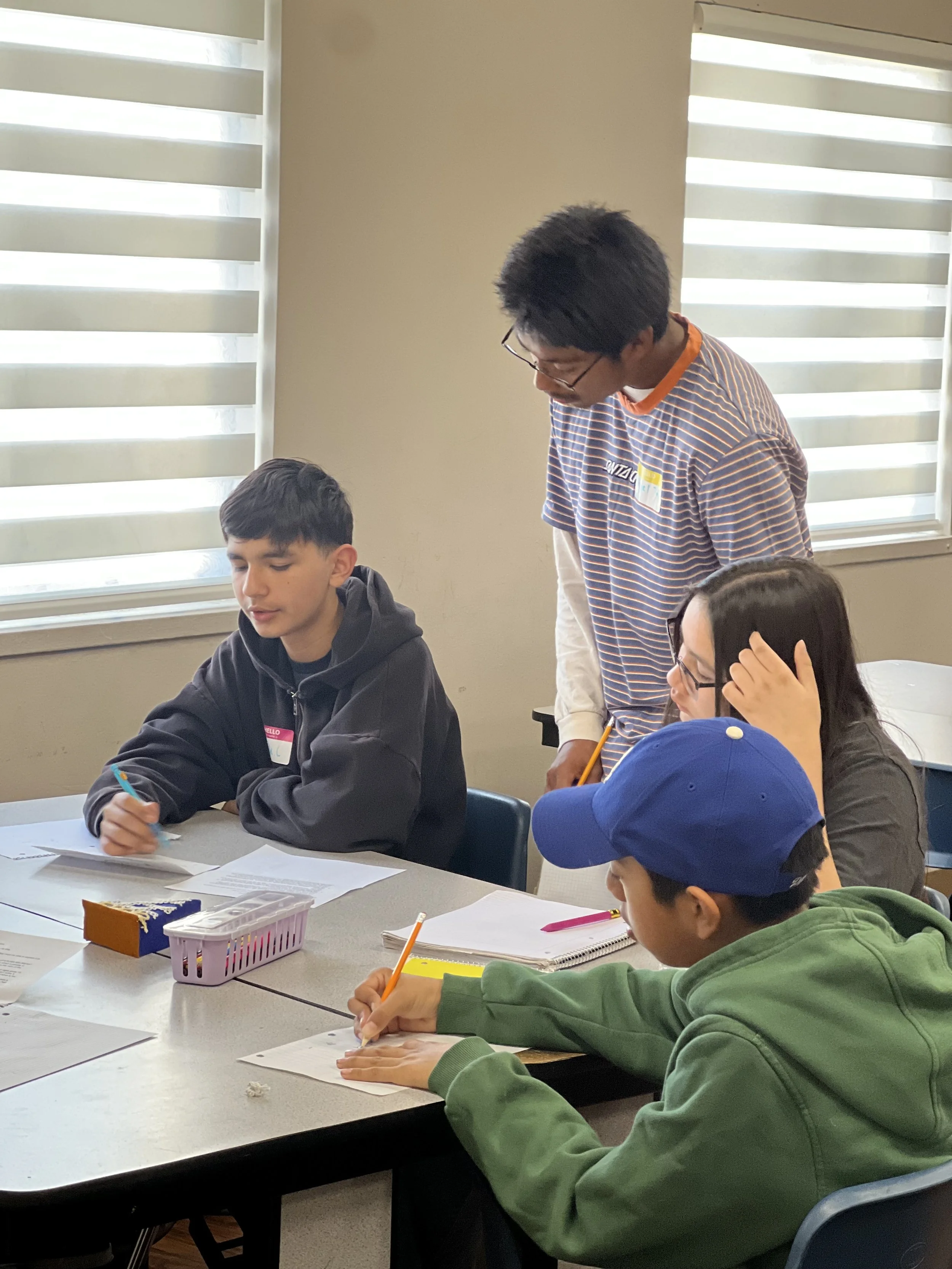  LA students work together to solve a problem during the Pi Day math relay! 