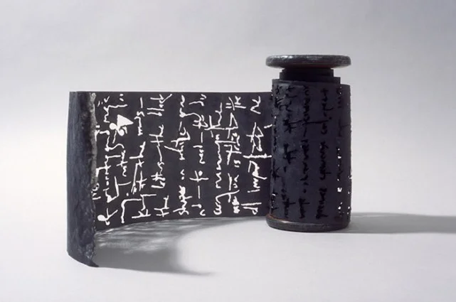 Black Torah, 2003, graphite, flax paper with text burnt out, 132" x 6"