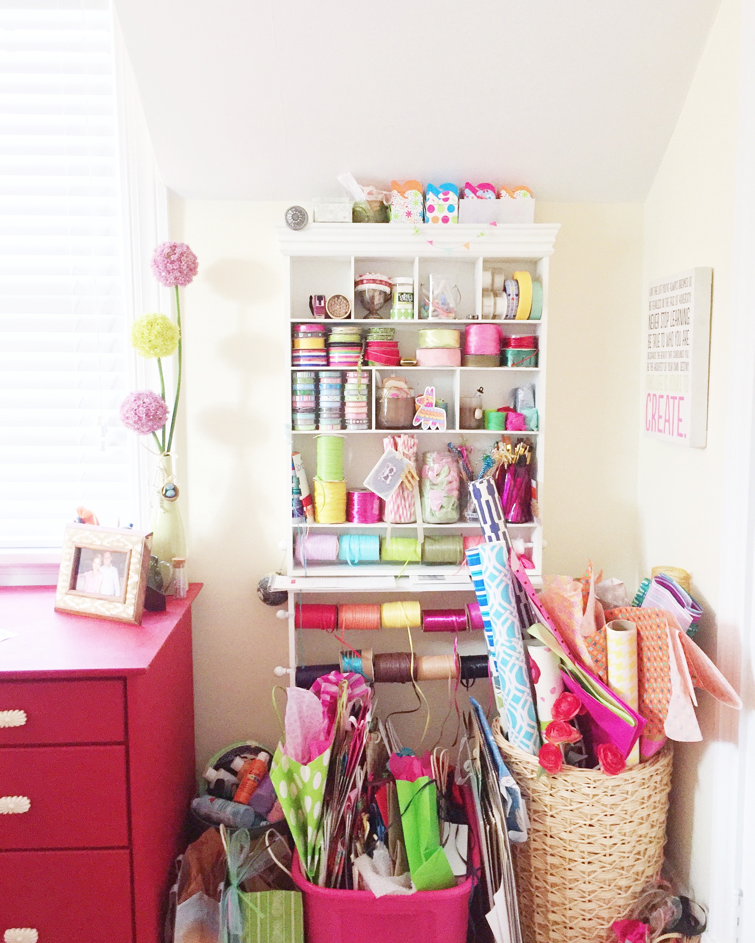 The main craft station including gift wrap, tissue paper, gift bags, ribbon and wraphia, tapes, small boxes and bags.