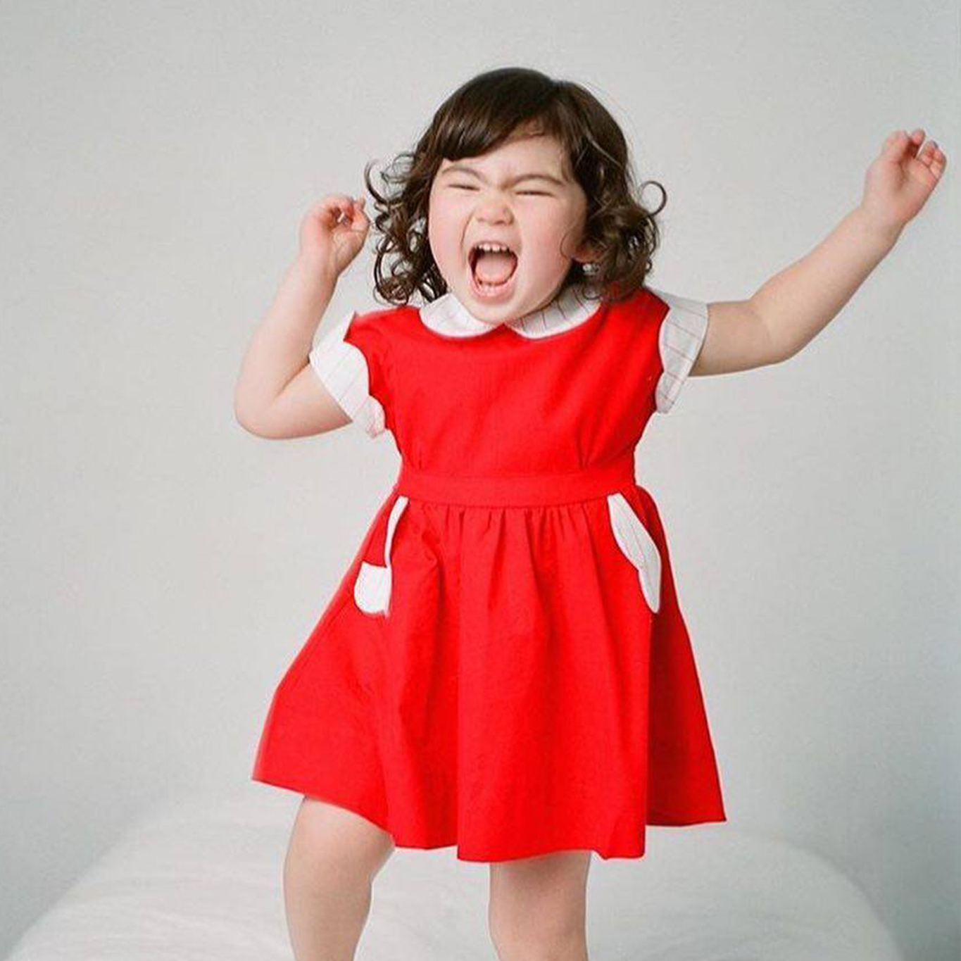 Girl in red holiday dress in Seattle mini sessions