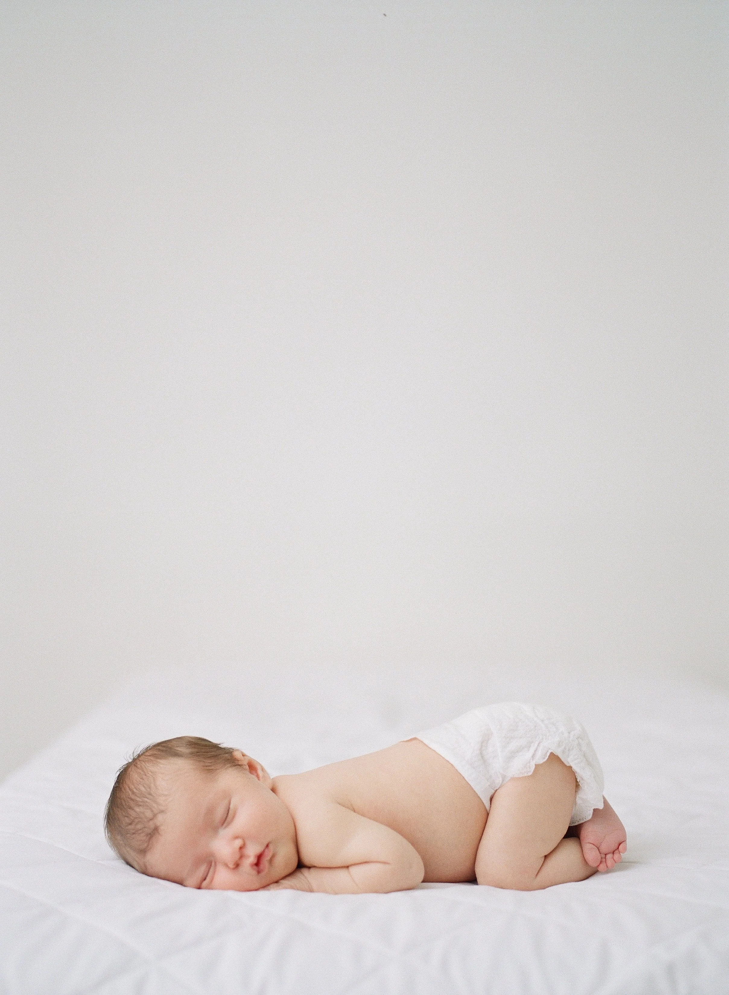 Natural vs. Posed Newborn Photography: Which Style Is Right for Your Family?