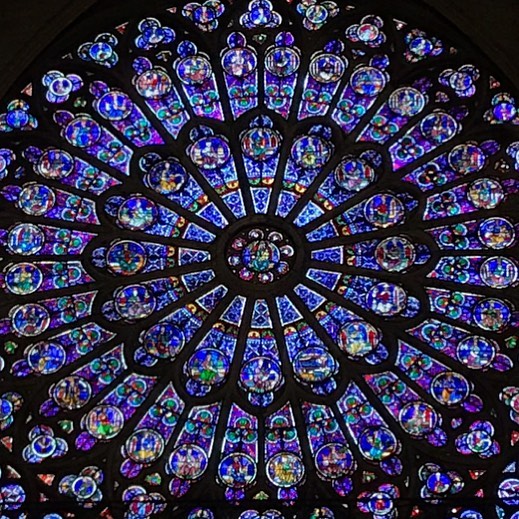 Heartbreaking evening  in Paris. I took this photo inside Notre Dame a few weeks ago. The north rose stained glass window dates from 1250.