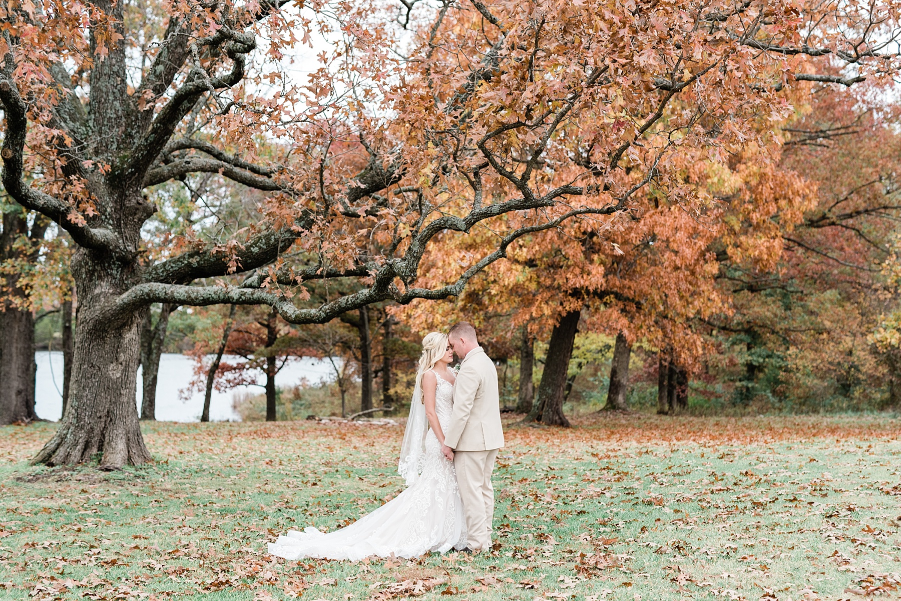 newly weds at fall wedding at mighty oak lodge missouri