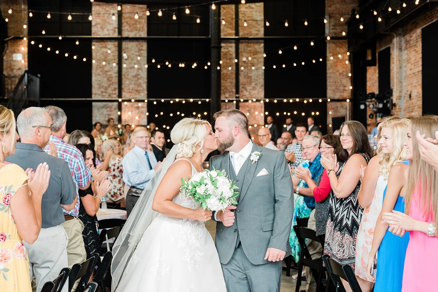 Rose Gold, White, and Greenery High Class Summer Wedding at The Millbottom in Downtown Jefferson City by Kelsi Kliethermes Photography_0056.jpg