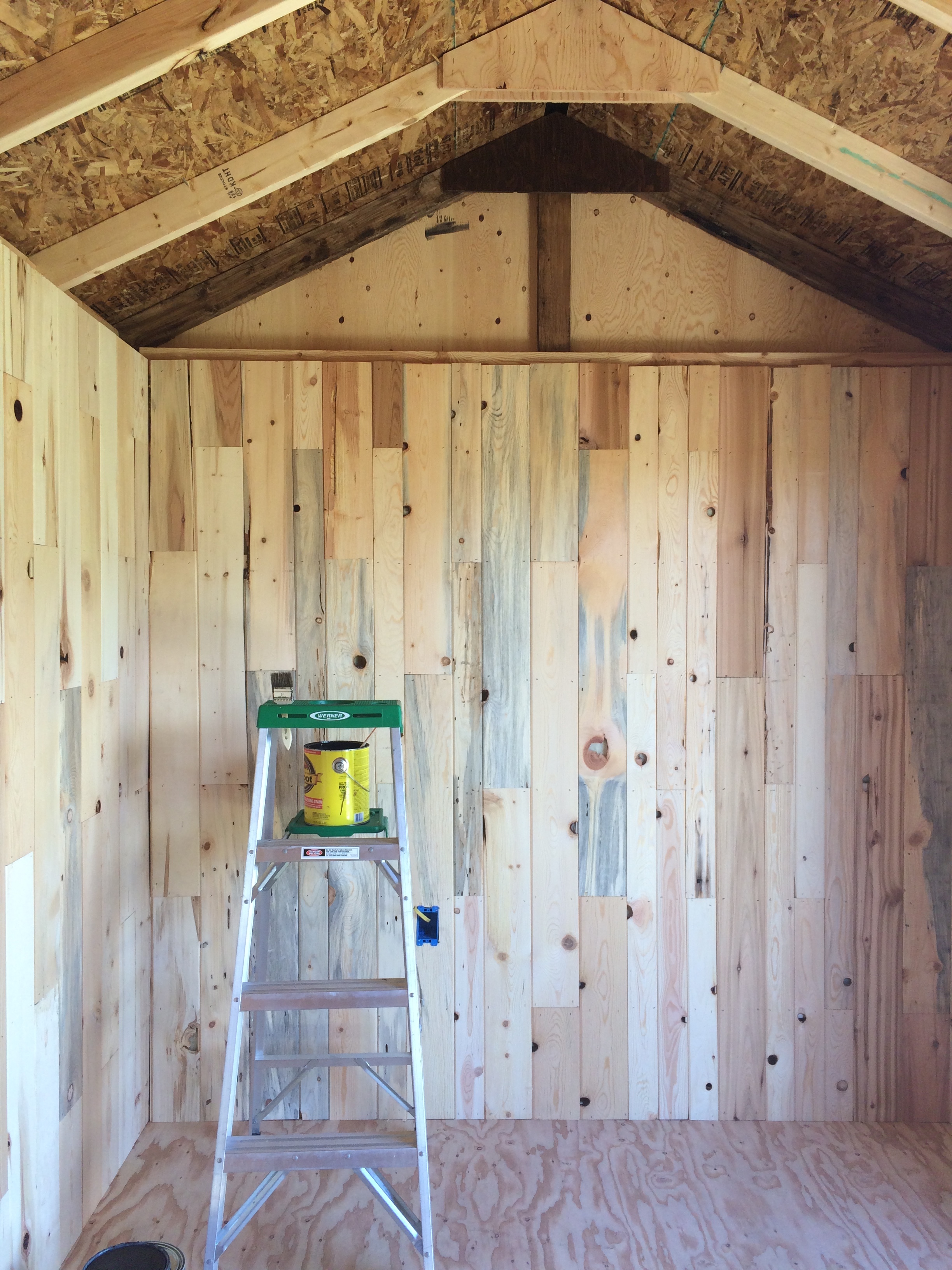 Half a beam in. I originally thought I could get away with not staining those triangular plywood pieces, but (surprise) I was wrong.