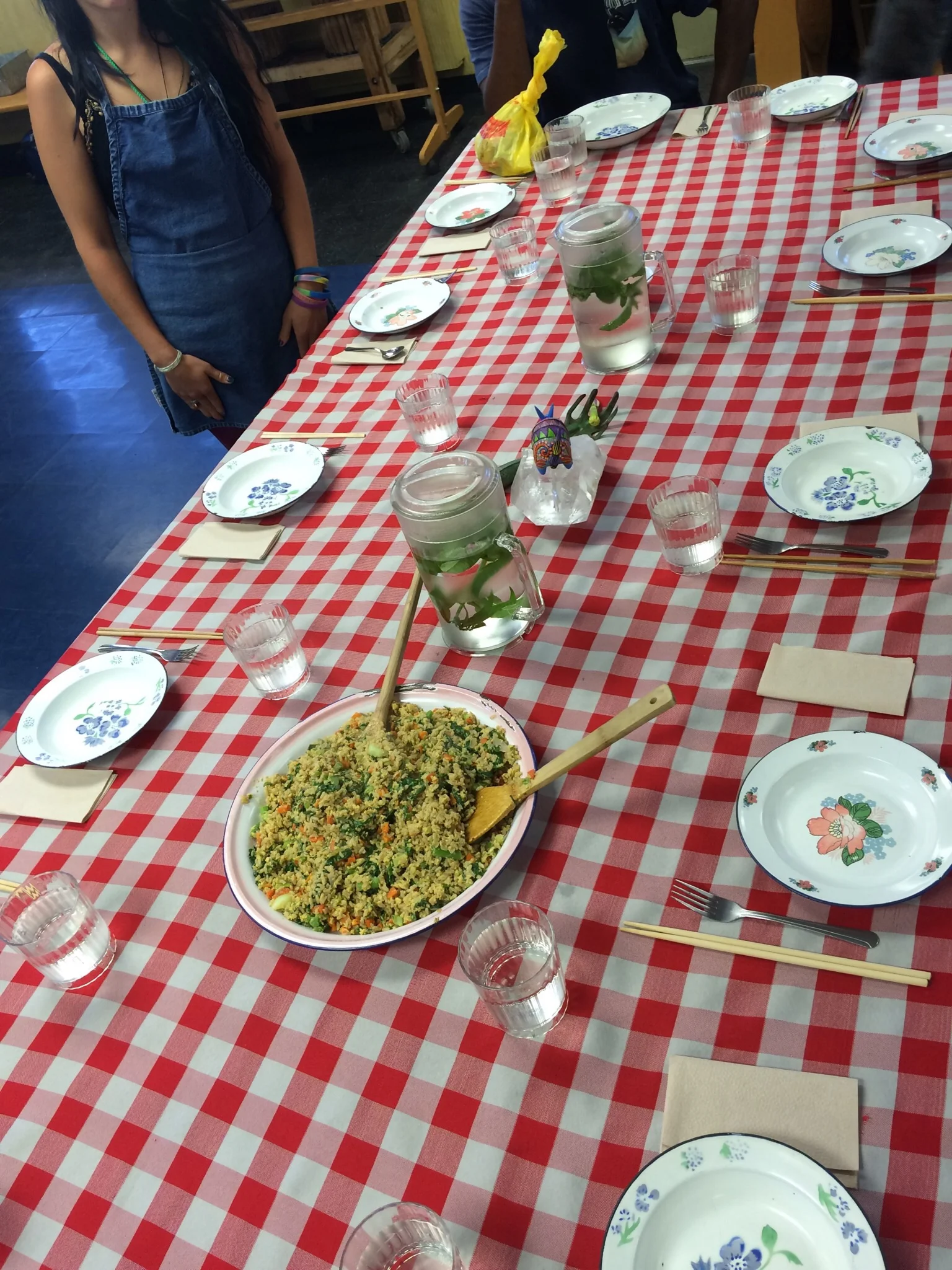 Step 4: While some students cook, others prepare the table. When the food is ready, everyone sits and eats together. Chef Teachers take time to facilitate reflection and conversation while they eat. Then, everyone works together to clean up.