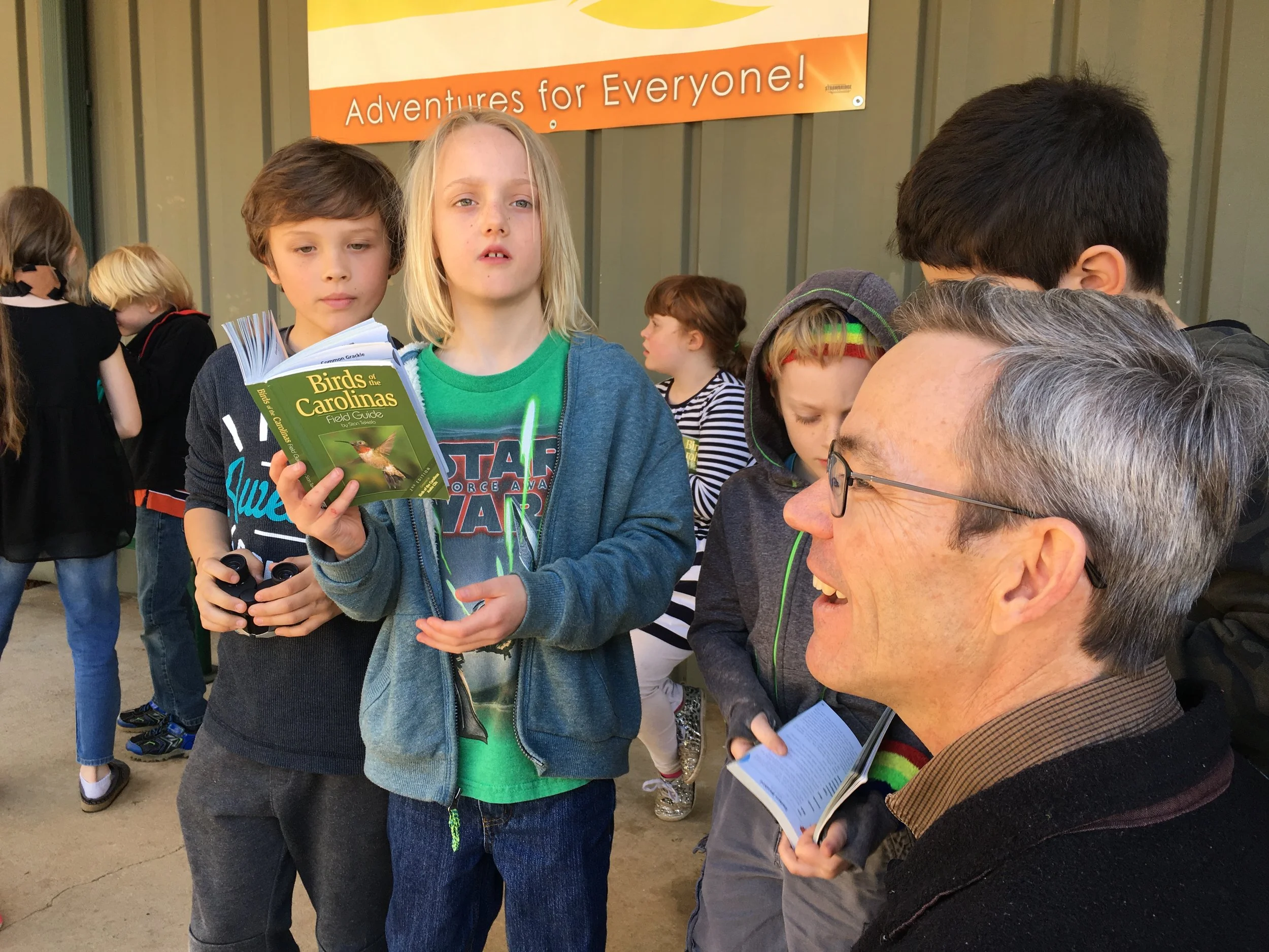In addition to learning how to use binoculars, students learn to use use ID guides to make educated guesses about the birds they are seeing or hearing in the field.
