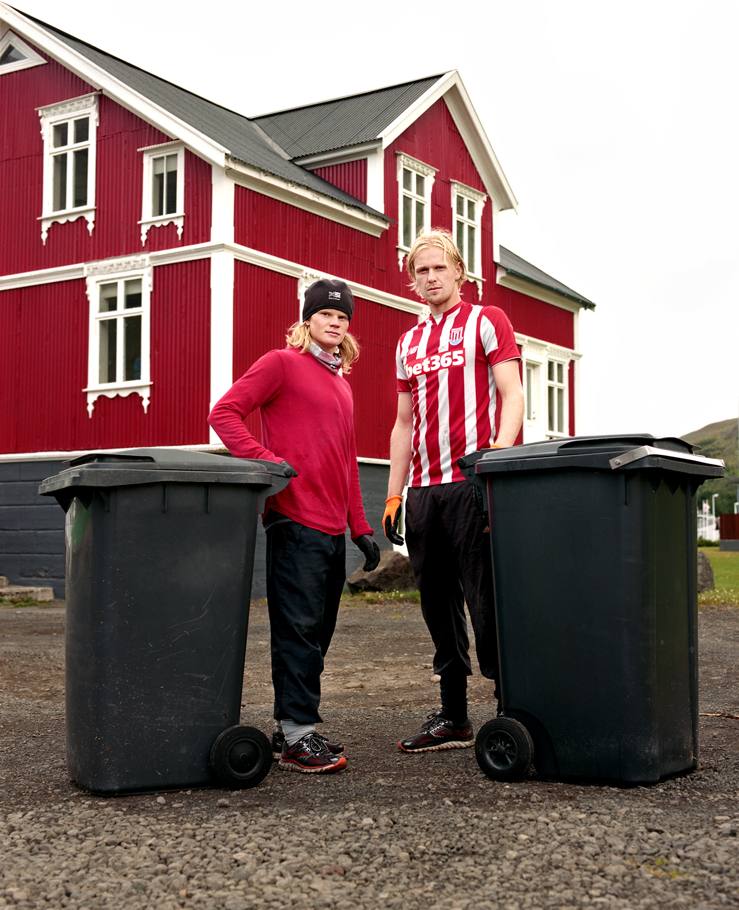  I was sitting at my desk when I saw Birkir and Kristófer hanging off the back of the garbage truck. I ran after them and had a minute to make their portrait. Their boss kept driving so as soon as we were done they had to run after him to collect the