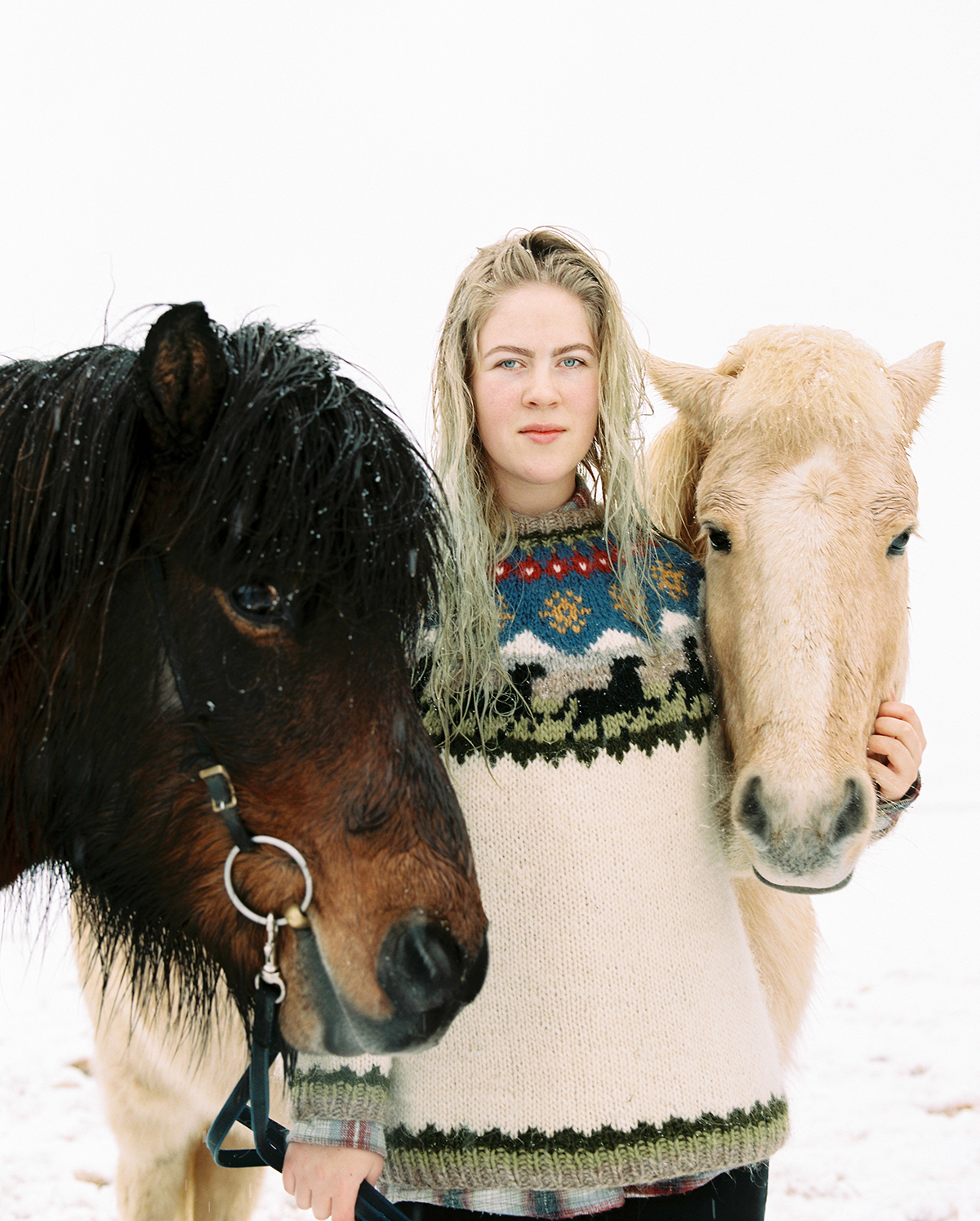 Sunna and Elgur (Moose) Elgur is an offspring from the only stallion her Father has bred. Elgur had been to 3 different trainers but none of them succeeded. Her Father decided to give it a try, riding him in deep snow so it was less likely he could run away. “He was very closed off and afraid, but curious, and therefore I connected with him. I remember feeling like a hero, 16 years old riding this crazy horse that everyone gave up on. Although he is blind, I still ride him, he's my ''round up'' horse.” Their trust in one another allows Sunna to take Elgur anywhere. “I've fallen off him so many times, but he always stops and waits for me to get back on. He understands me, and I understand him so well. I can't really explain it better, it's just a feeling.”