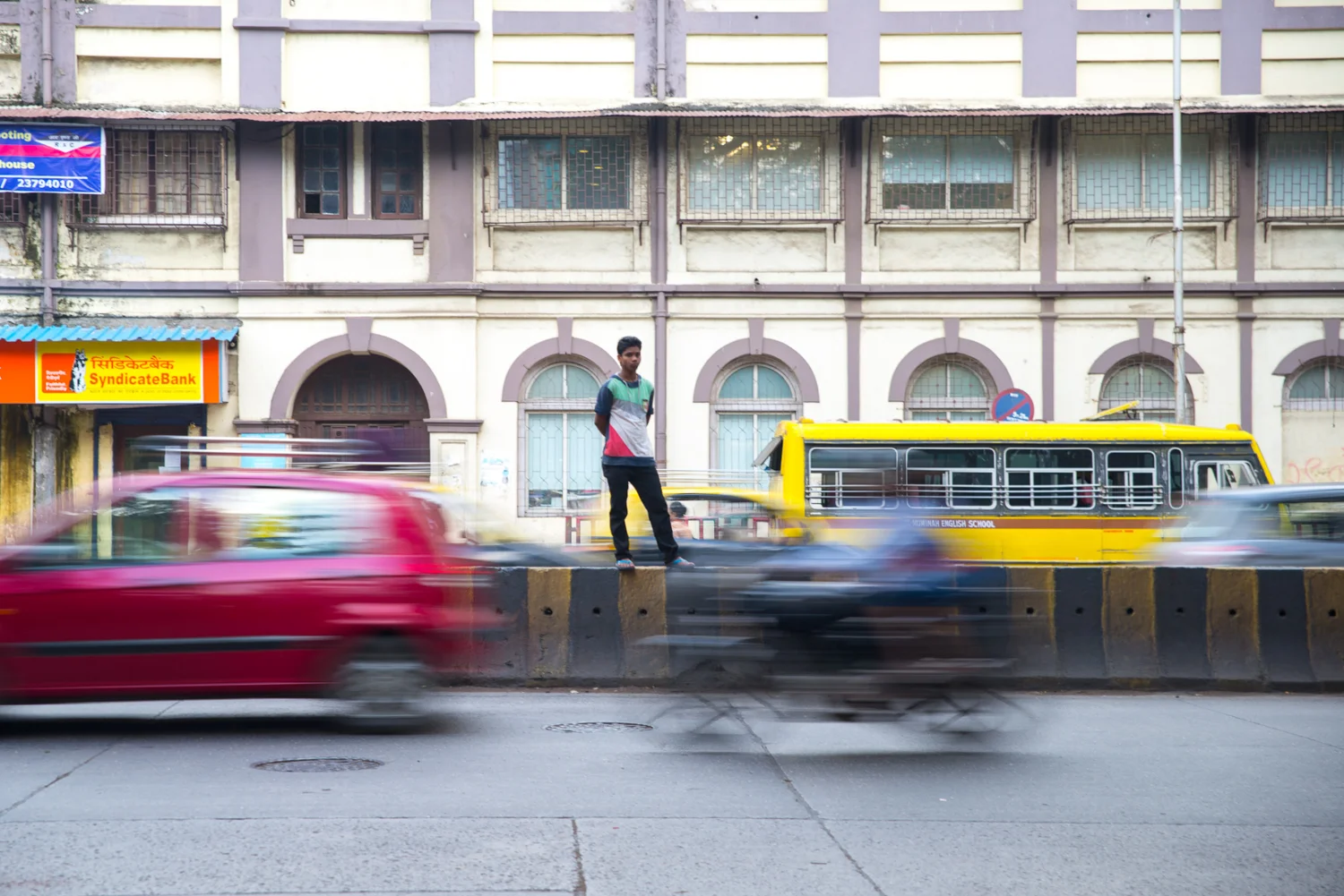 A man attempts to cross a busy street in Mumbai, India, on September 19, 2014. 