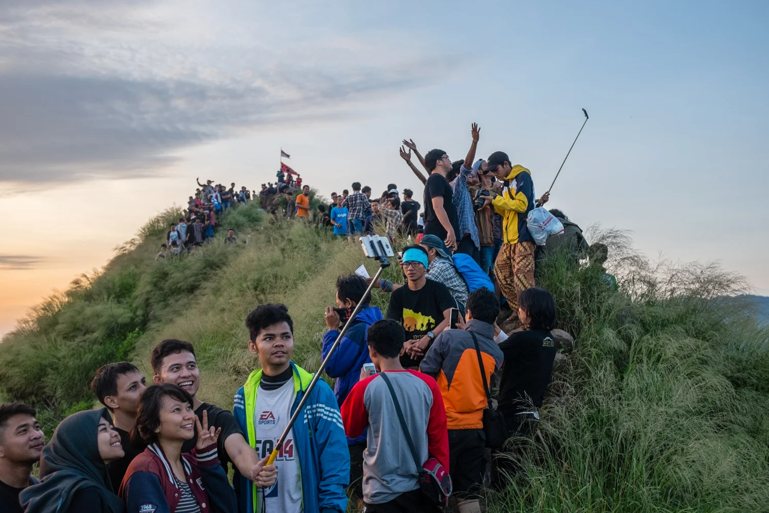 Hikers take photos and selfies after a sunrise hike up Mt. Batu in Jonggol, West Java, Indonesia, on April 12, 2015. 
