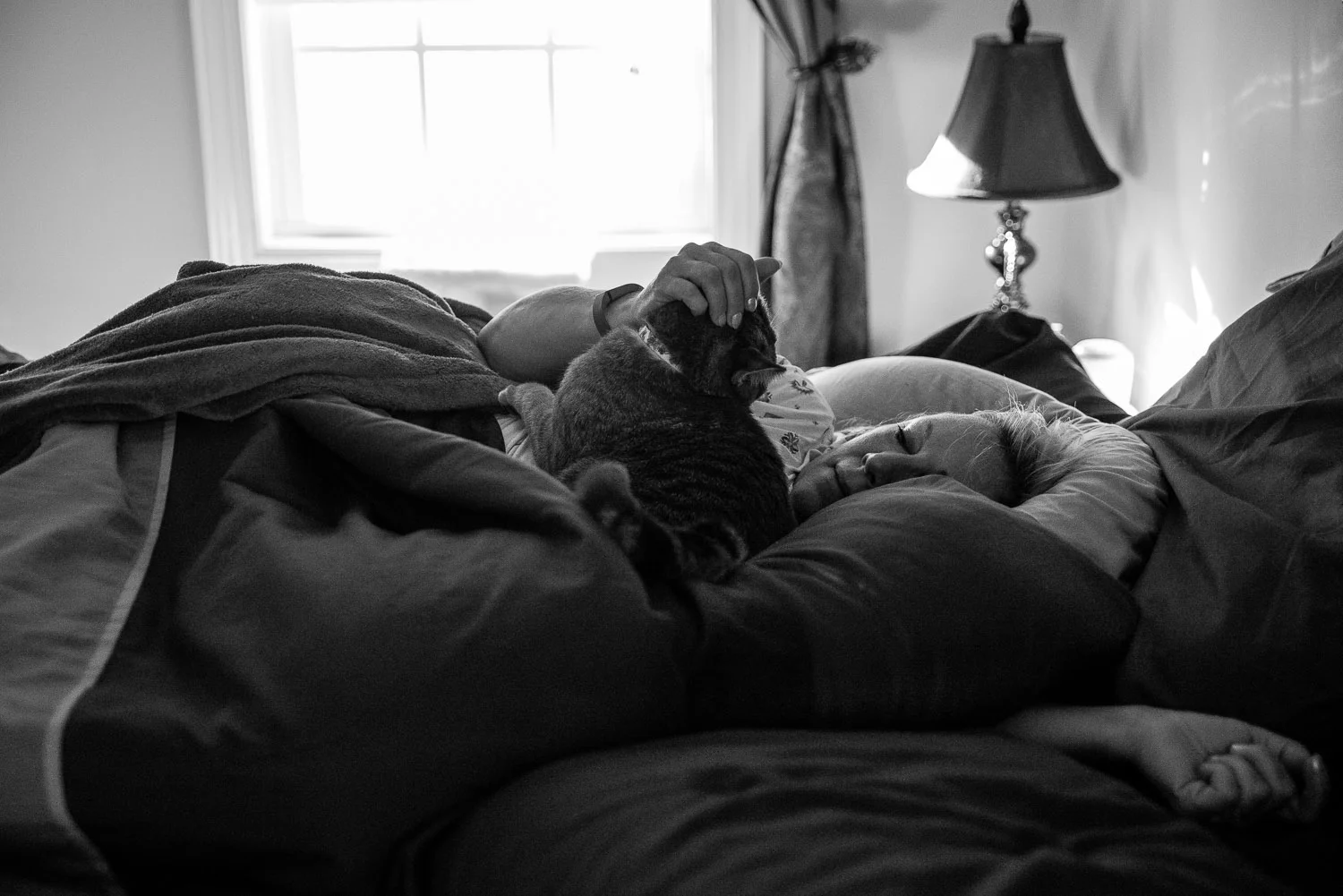 Julie sometimes feels the house is too big for her without Kenny there. Sometimes she sleeps in their bed (pictured here) and sometimes in the guest bedroom down the hall.
