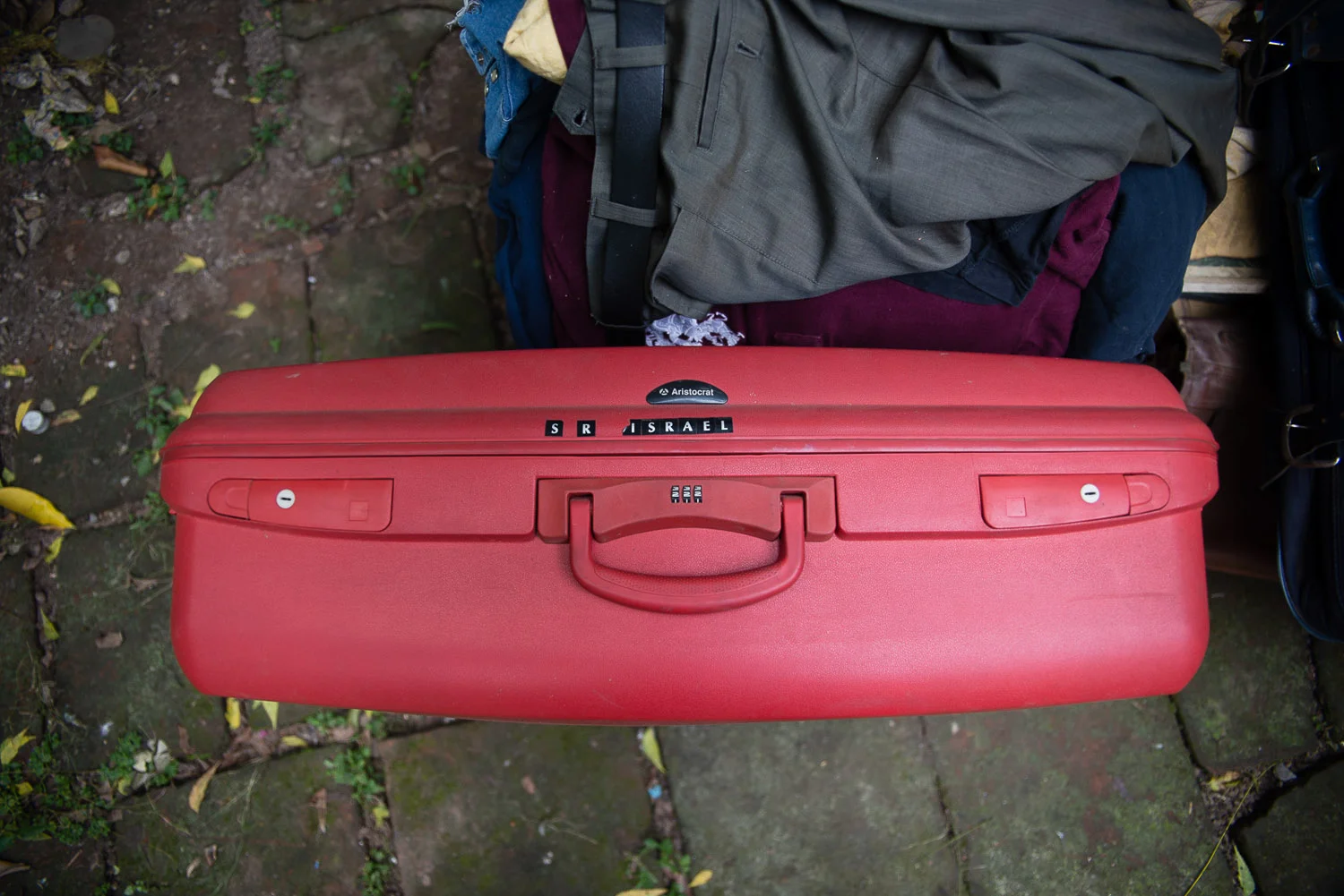 "I'm moving from a house to a suitcase," says Shalom. "It's a lot of work." Shalom is giving away or seling most of his belongings. What will he take with him? "Mostly spices, cooking sauces, and wine", he says. An avid cook, he wants to make sure he has the flavors of India in his new home.