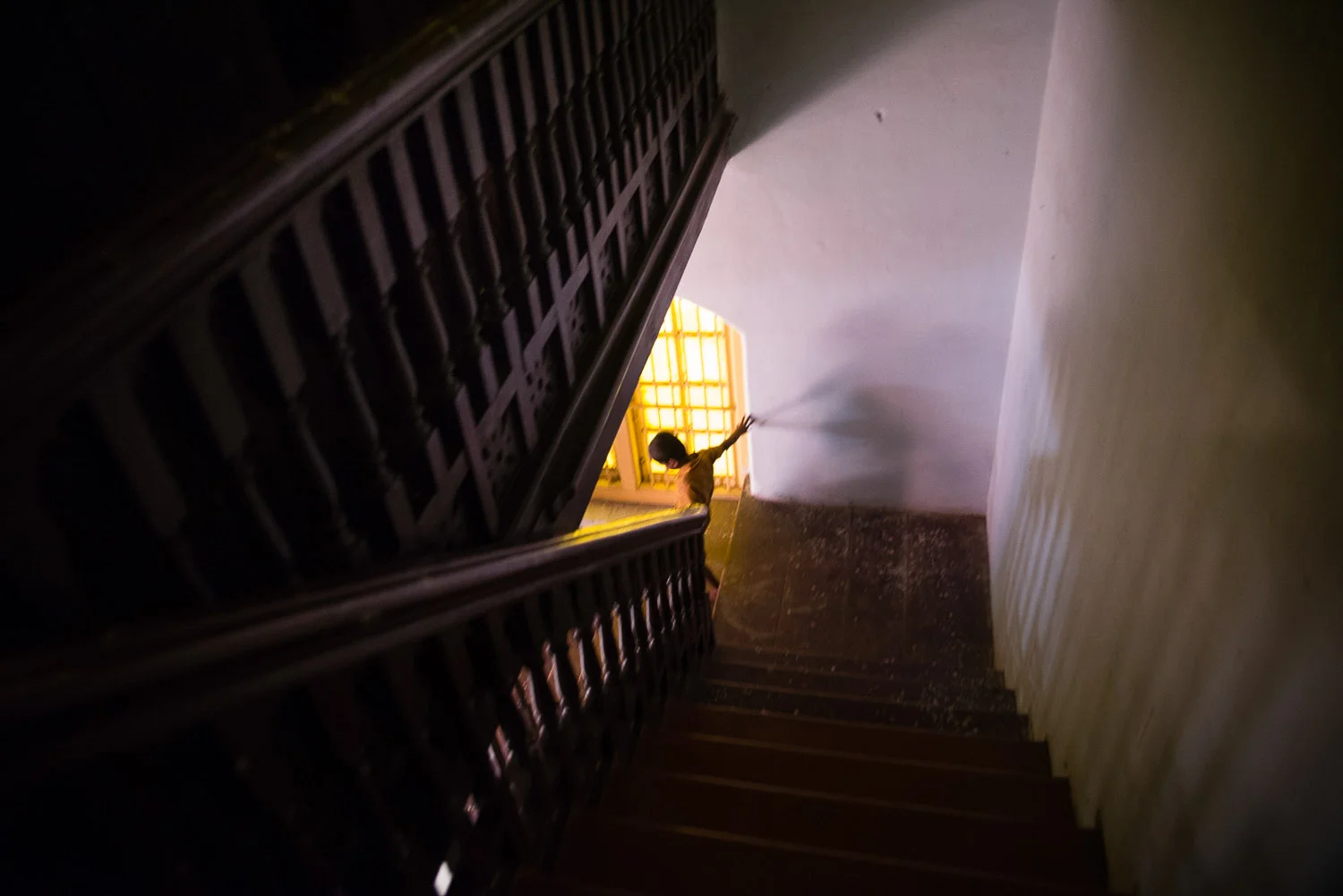 While Mumbai boasts the largest Bene Israel congregations, Pune, 3 horus from Mumbai, has two working synagogues and several hundred members. Here, the child of the caretaker iat the Succoth Synaoggue runs down the stairs. THey are in preparation for Rosh Hoshanah services, and are cleaning out the synagogue.